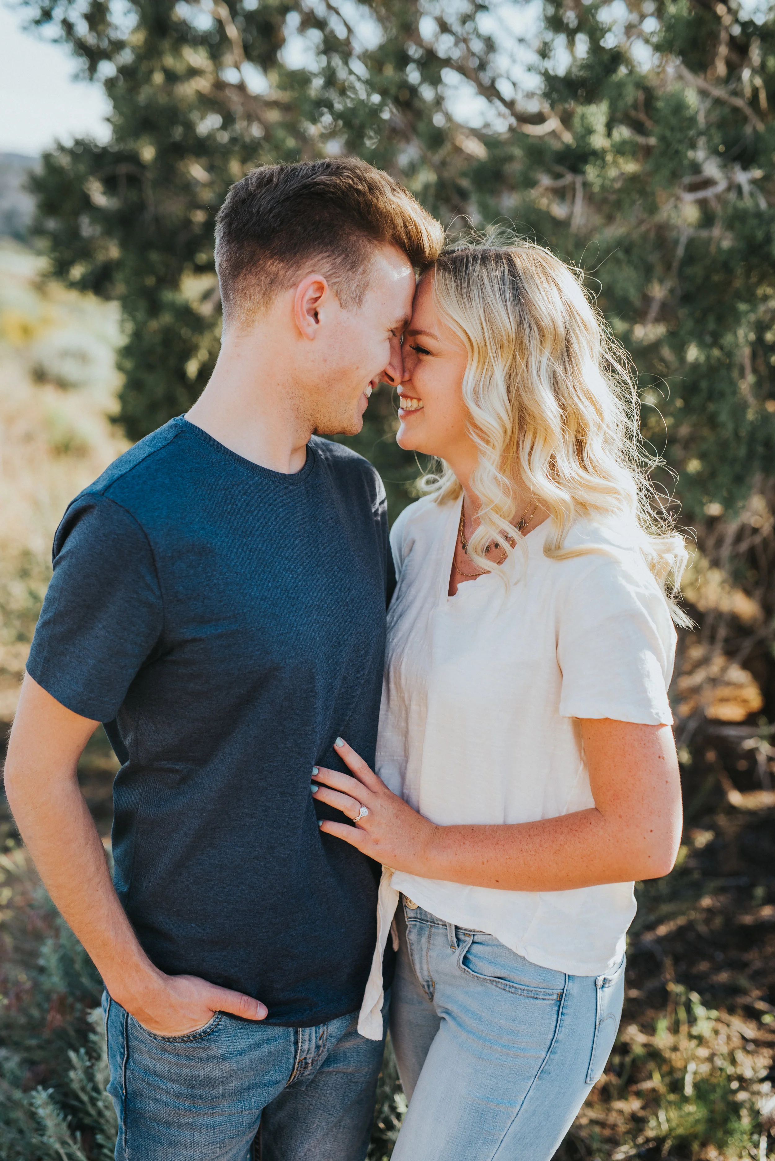  hugging laughing playful engagement session neutral outfit inspiration engaged happy outdoors saint george utah photography nothern utah professional photographer casual dress engagements #Saintgeorgephotography #snowcanyon #engagementsession #utah 