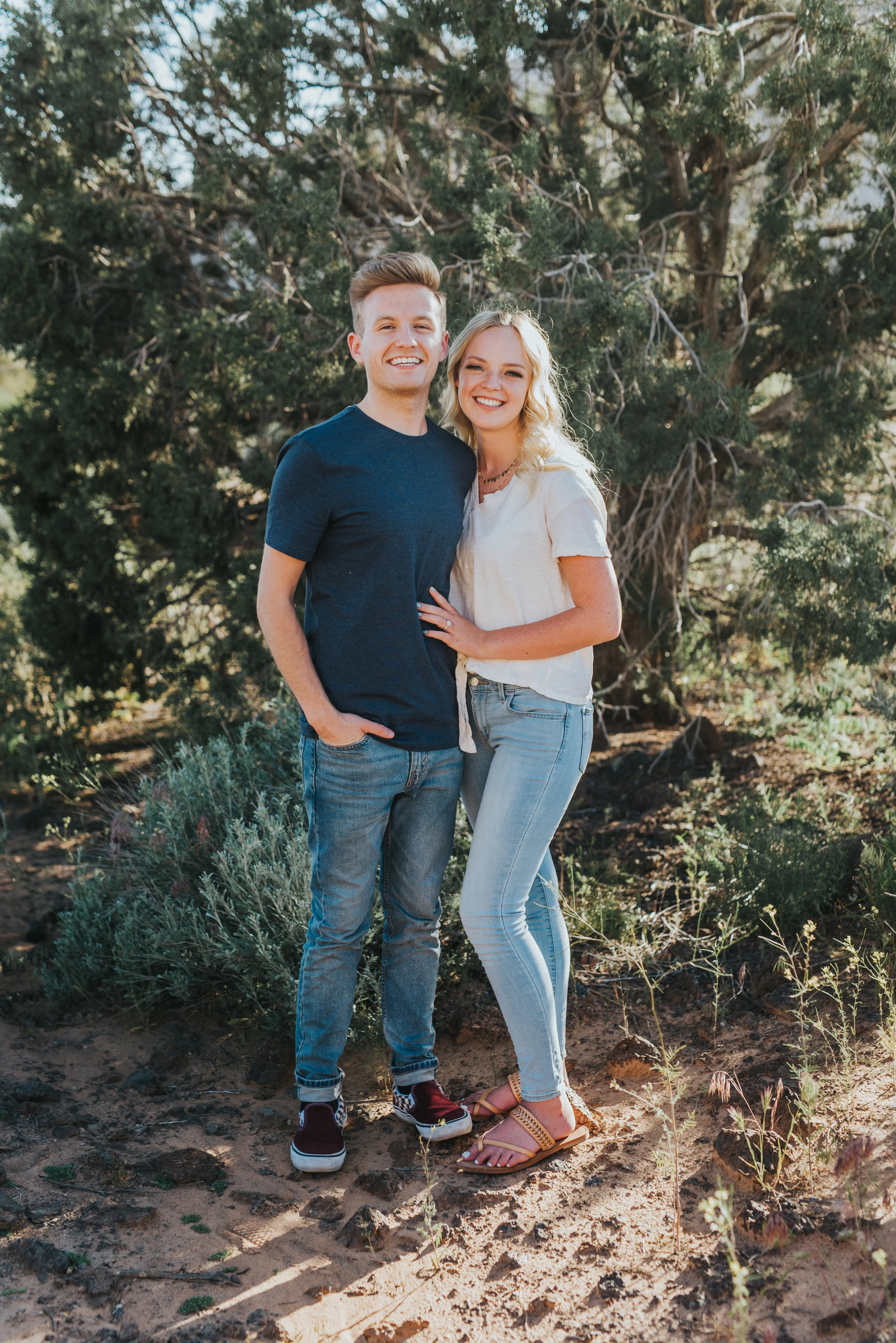  wooded outdoor engagement session snow canyon saint george utah engagement photographer northern utah photography casual engagement outfits standing hugging jeans outfit inspiration dirt pathway canyon utah #saintgeorgephotography #snowcanyon #engag