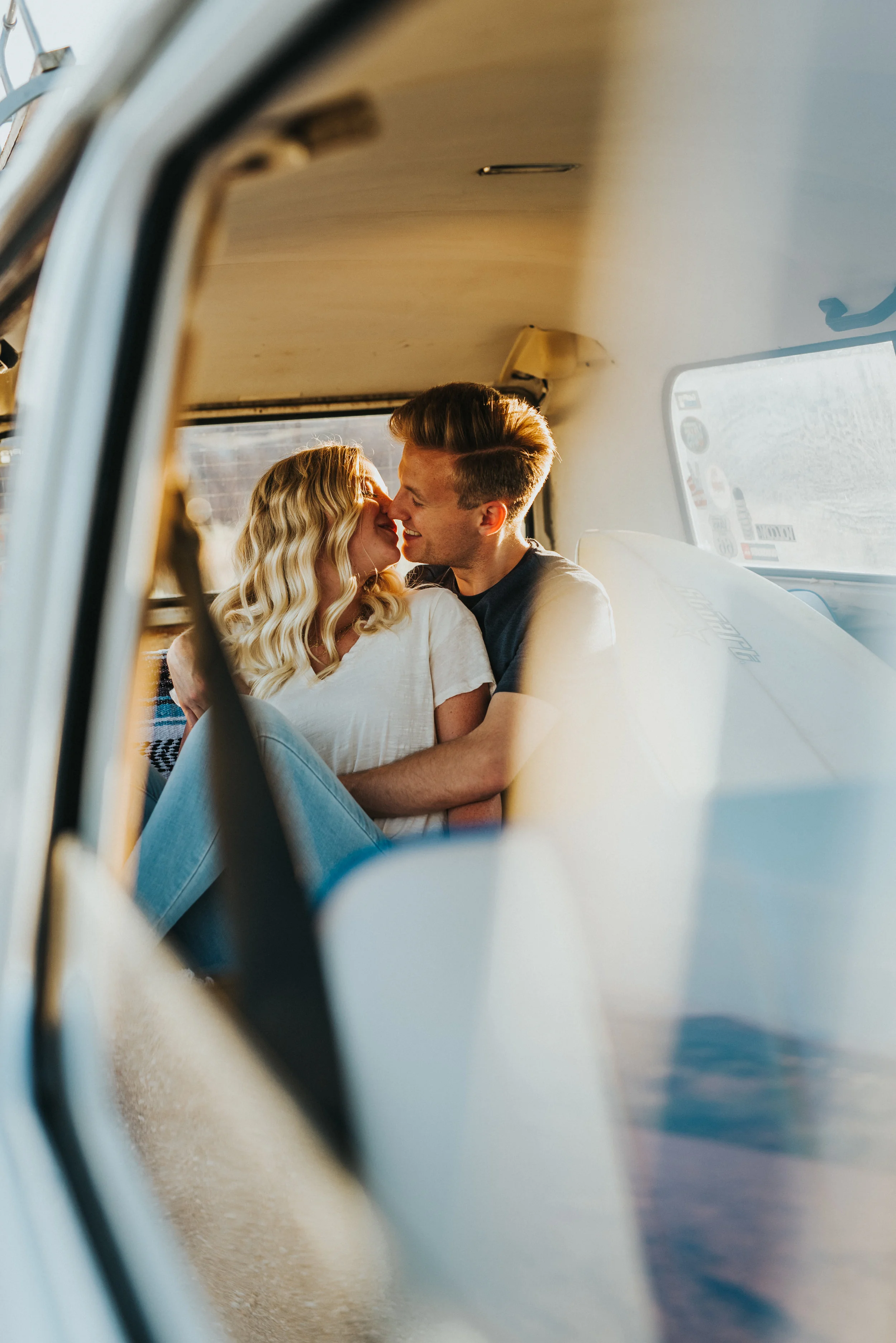  vintage VW van blue backseat kissing candid photos laughing playful snow canyon engagement session happy saint george utah northern utah engagement photographer casual outfit inspiration #saintgeorgephotography #snowcanyon #engagementsession #utah #