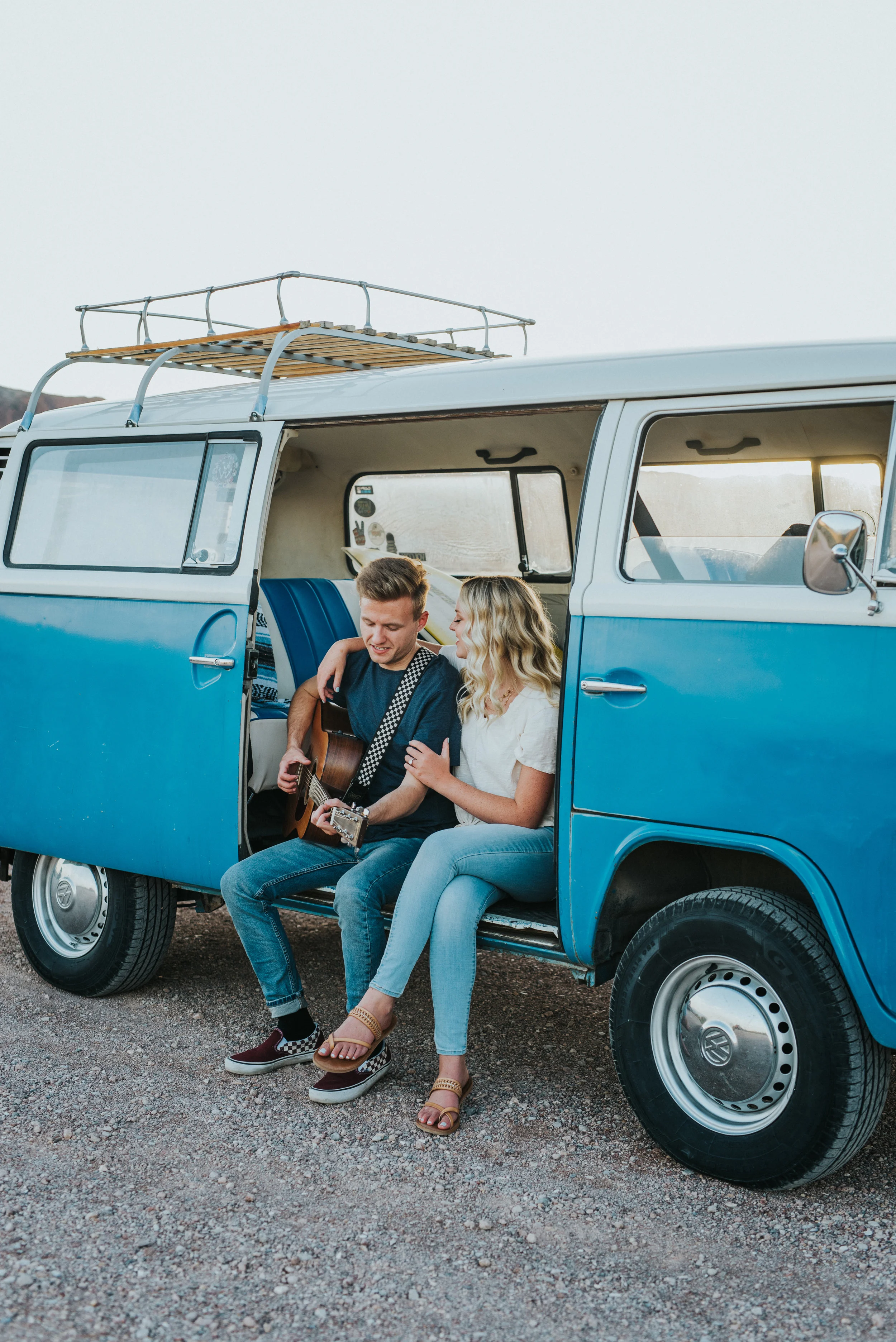  casual engagement outfit inspiration neutral colors vintage blue VW van remodeled car guitar serenade romantic desert gravel road snow canyon utah saint george utah hugging intimate authentic photography #saintgeorgephotography #snowcanyon #engageme