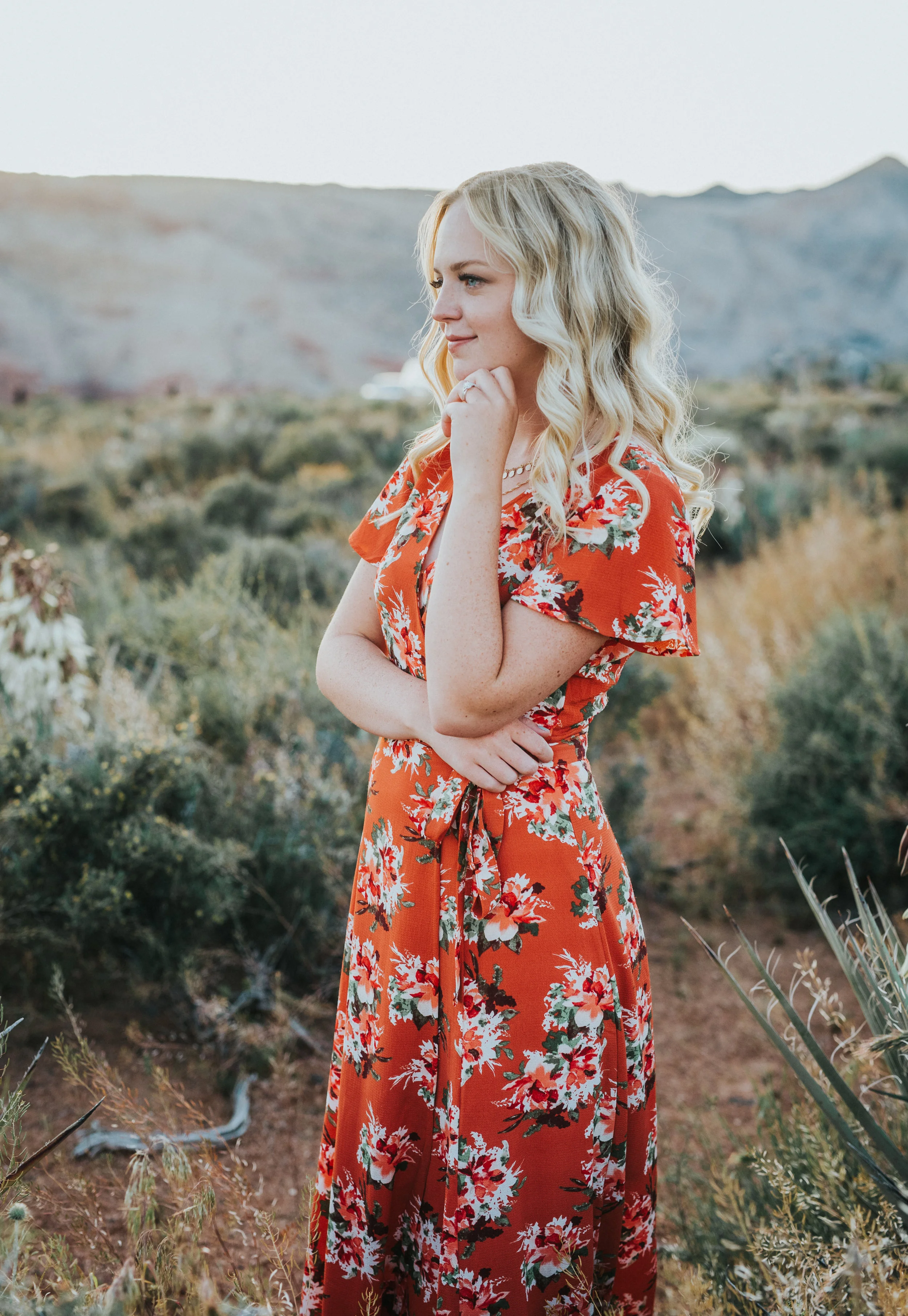  blonde hair inspiration wavy hair floral orange dress snow canyon utah bohemian engagement fiance portrait photos tall grasses desert saint george utah northern utah engagement photographer #saintgeorgephotography #snowcanyon #engagementsession #uta