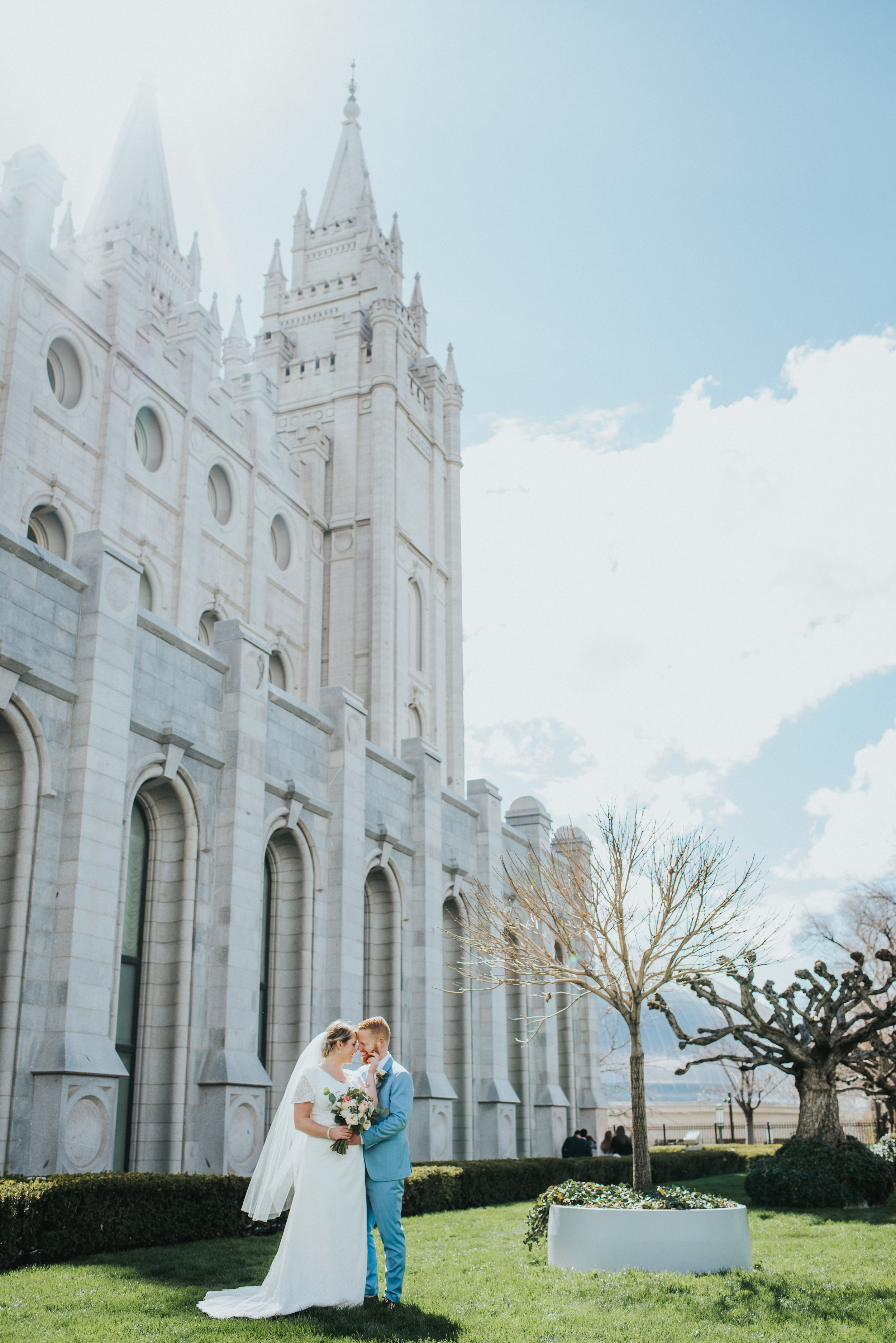  salt lake city temple utah wedding lds temple grounds wedding photos blue skies long veil modest wedding dress powder blue wedding suit groom bride pastel wedding colors bouquet  #northernutahweddingphotographer #saltlakecityphotographer #weddingpho