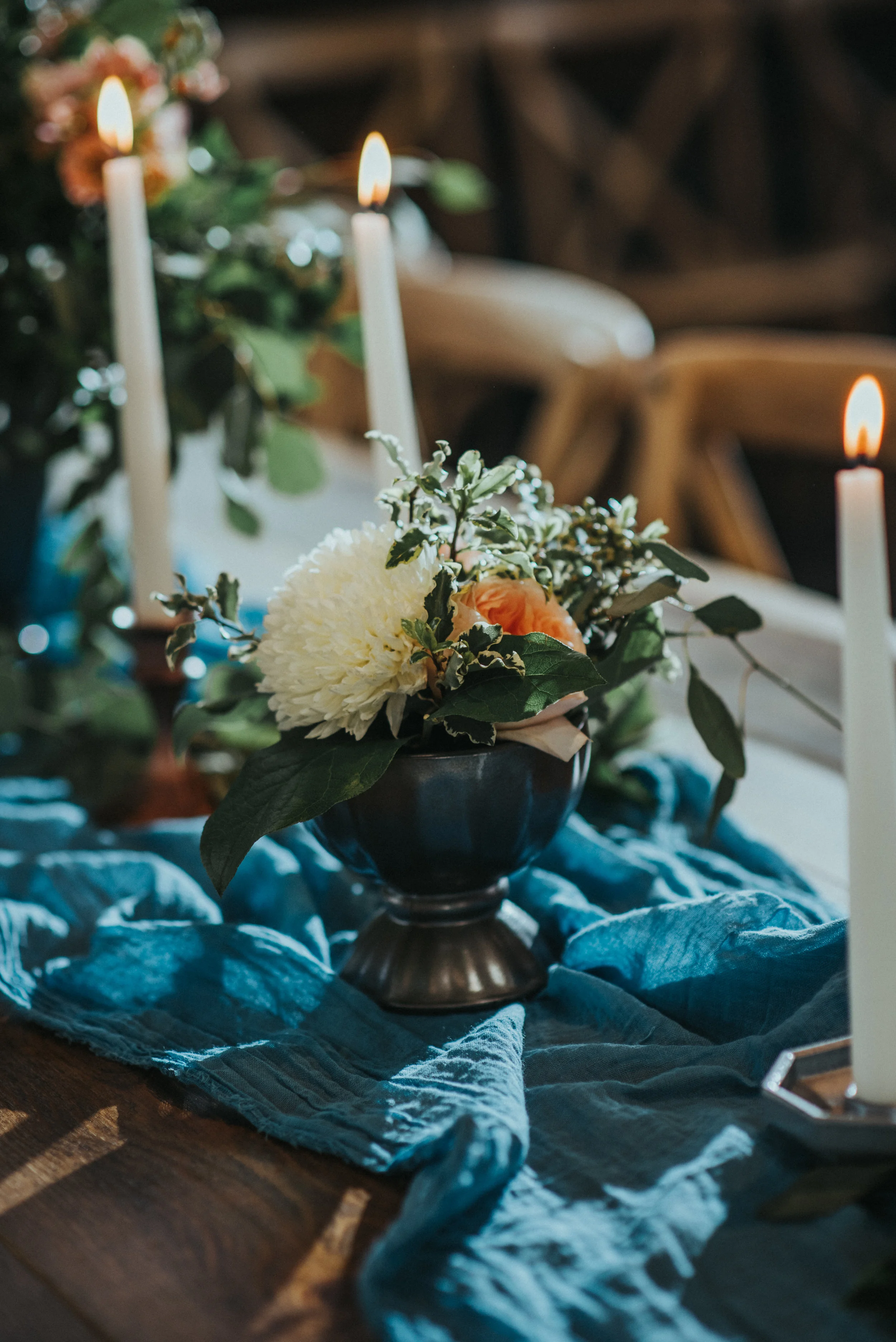 knot and pine alpine barn reception center rustic wedding decor pastel color scheme blue table runner candle lit wedding reception dinner nothern utah wedding photographer salt lake city utah floral centerpieces rustic wedding #northernutahweddingph