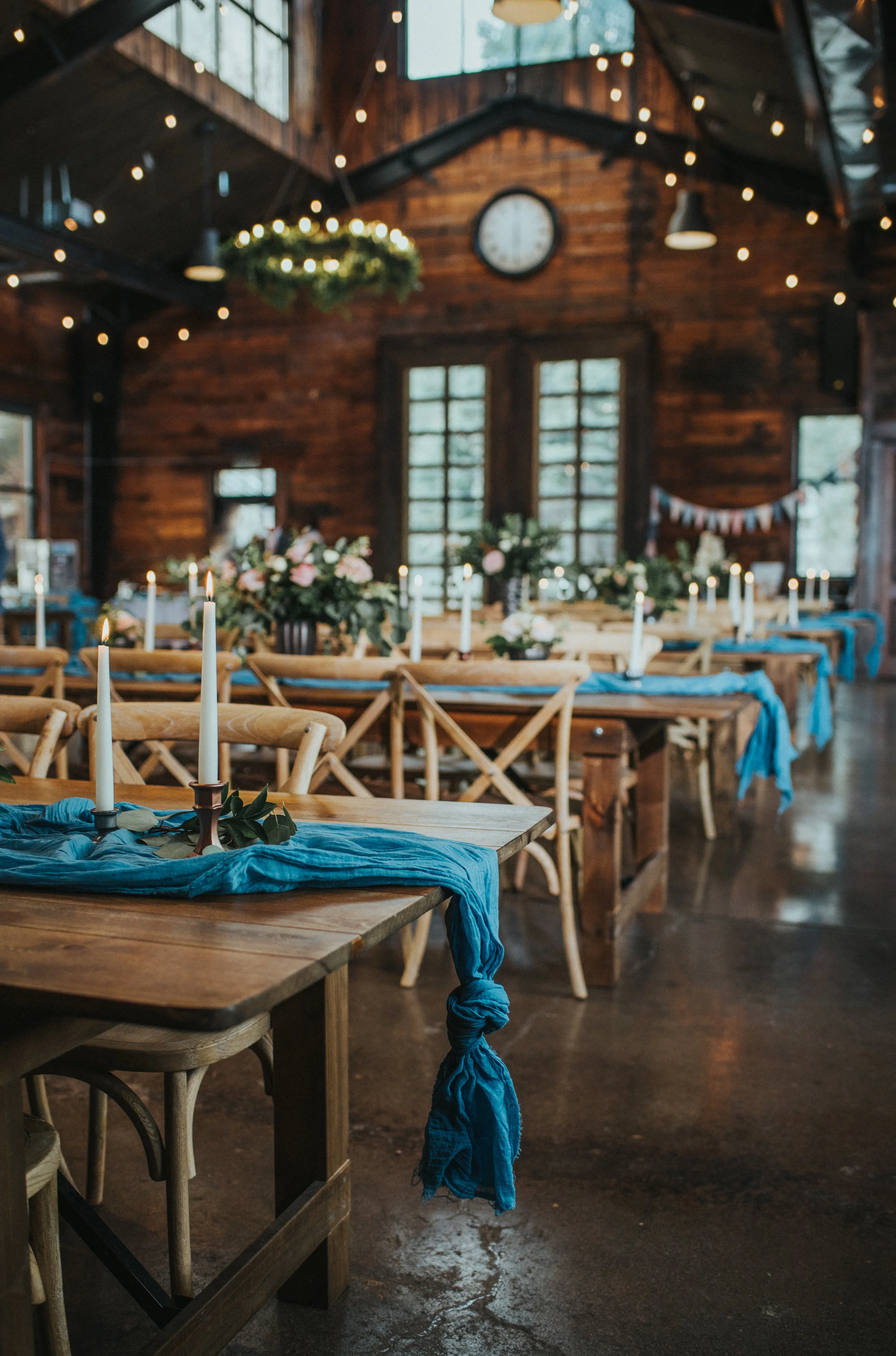  blue draped table cloths wedding table rustic pastel rose floral centerpiece northern utah wedding photographer salt lake city utah alpine utah knot and pine alpine barn romantic candle lit reception center #northernutahweddingphotographer #saltlake