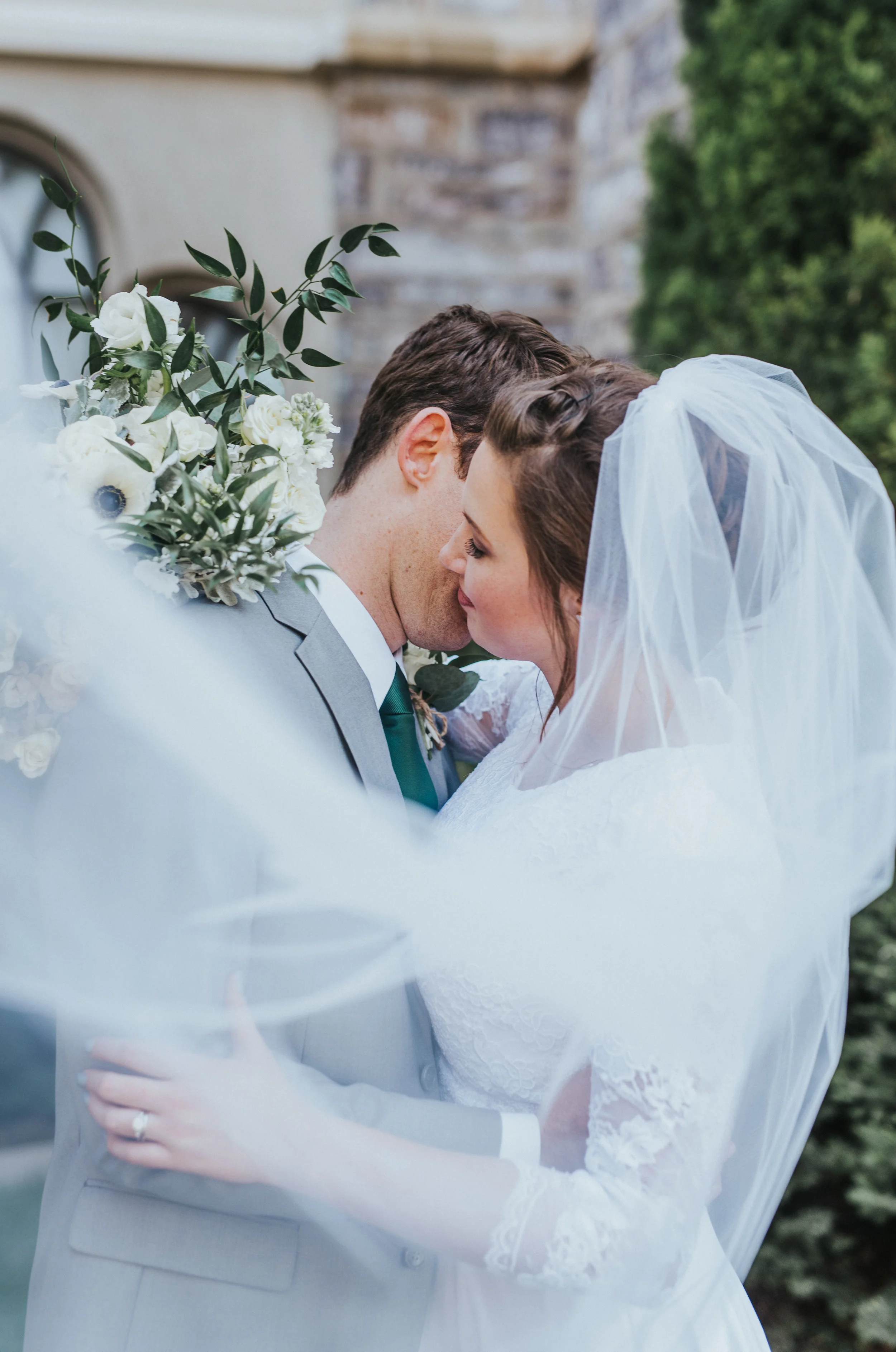  intimate wedding photos utah wedding photographer elegant wedding pictures vail picture inspiration for weddings Logan LDS temple happy couple wedding hairstyles fancy suit lace wedding dress long sleeve wedding dress couple posing ideas husband and