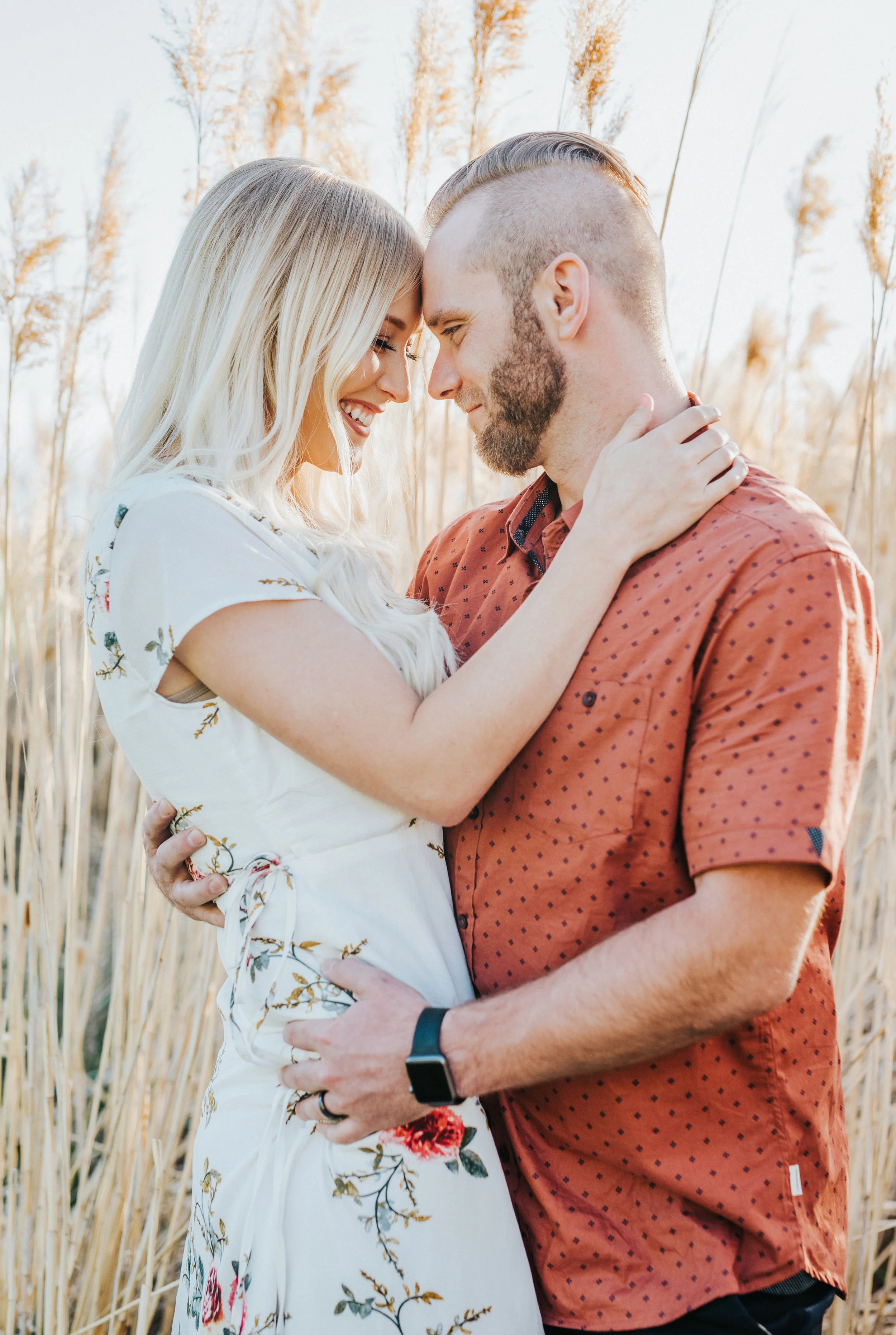  professional northern utah engagement session logan utah photography tunnel springs engagement tall grass nature bohemian engagement session floral long dress hugging foreheads touching smiling happy romantic cache valley #engagementphotography #not