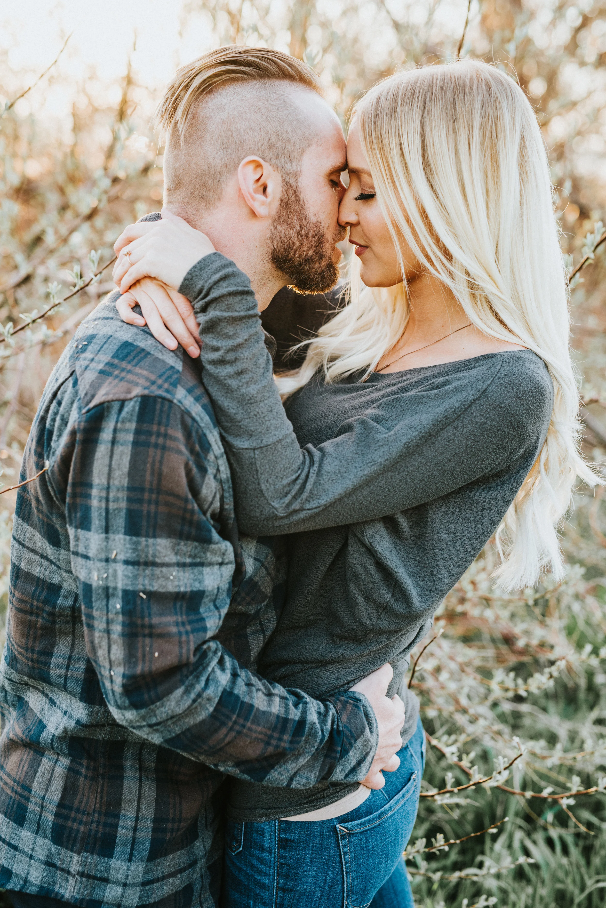  northern utah engagement photographer professional fall family photos romantic kissing hugging boho inspired blonde hair inspiration cache valley utah logan utah casual jeans plaid shirt #engagementphotography #nothernutahphotographer #loganutah #tu
