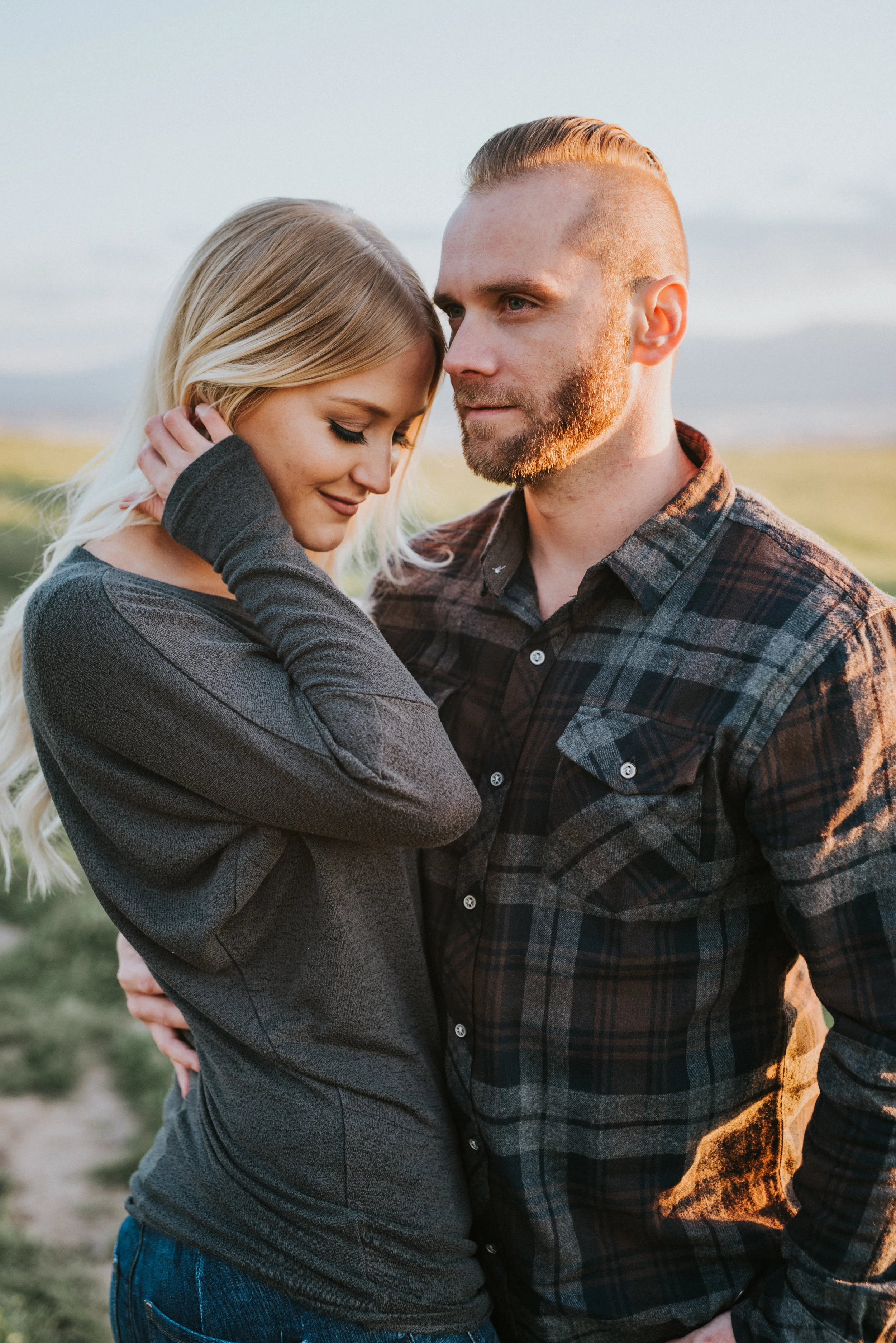 vast green field tunnel springs utah candid engagement photos northern utah engagement photographer professional fall colored engagement clothes hugging blue skies cache valley photography logan utah plaid shirt #engagementphotography #nothernutahph