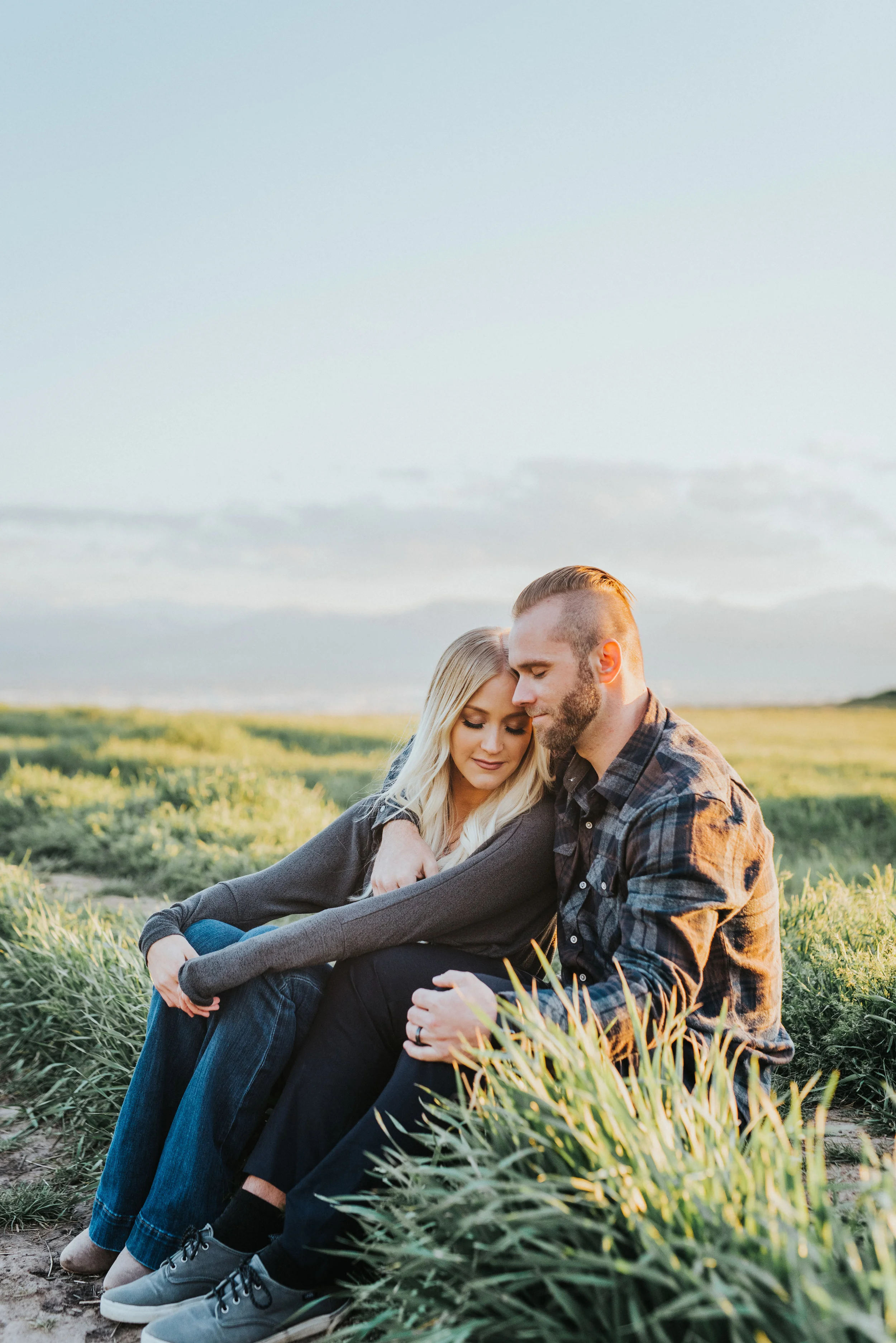  tunnel springs engagement session green fields fall photos romantic sitting hugging blonde hair inspiration faded haircut blue skies cache valley utah logan utah nothern utah professional engagement photographer #engagementphotography #nothernutahph