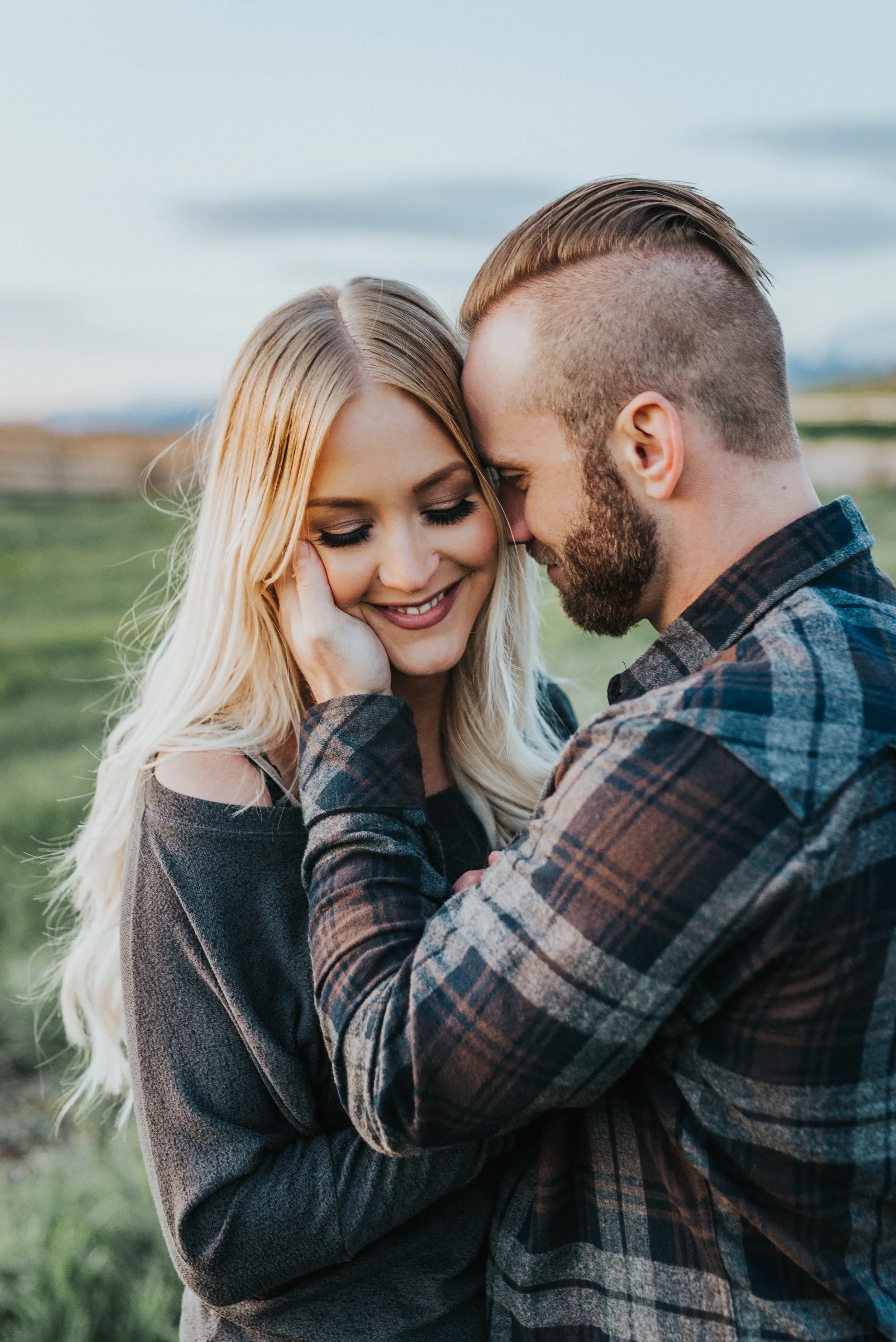  logan utah engagement photographer hugging romantic fall engagement session green field tunnel springs northern utah professional photography cache valley family photos plaid shirt casual engagement #engagementphotography #nothernutahphotographer #l