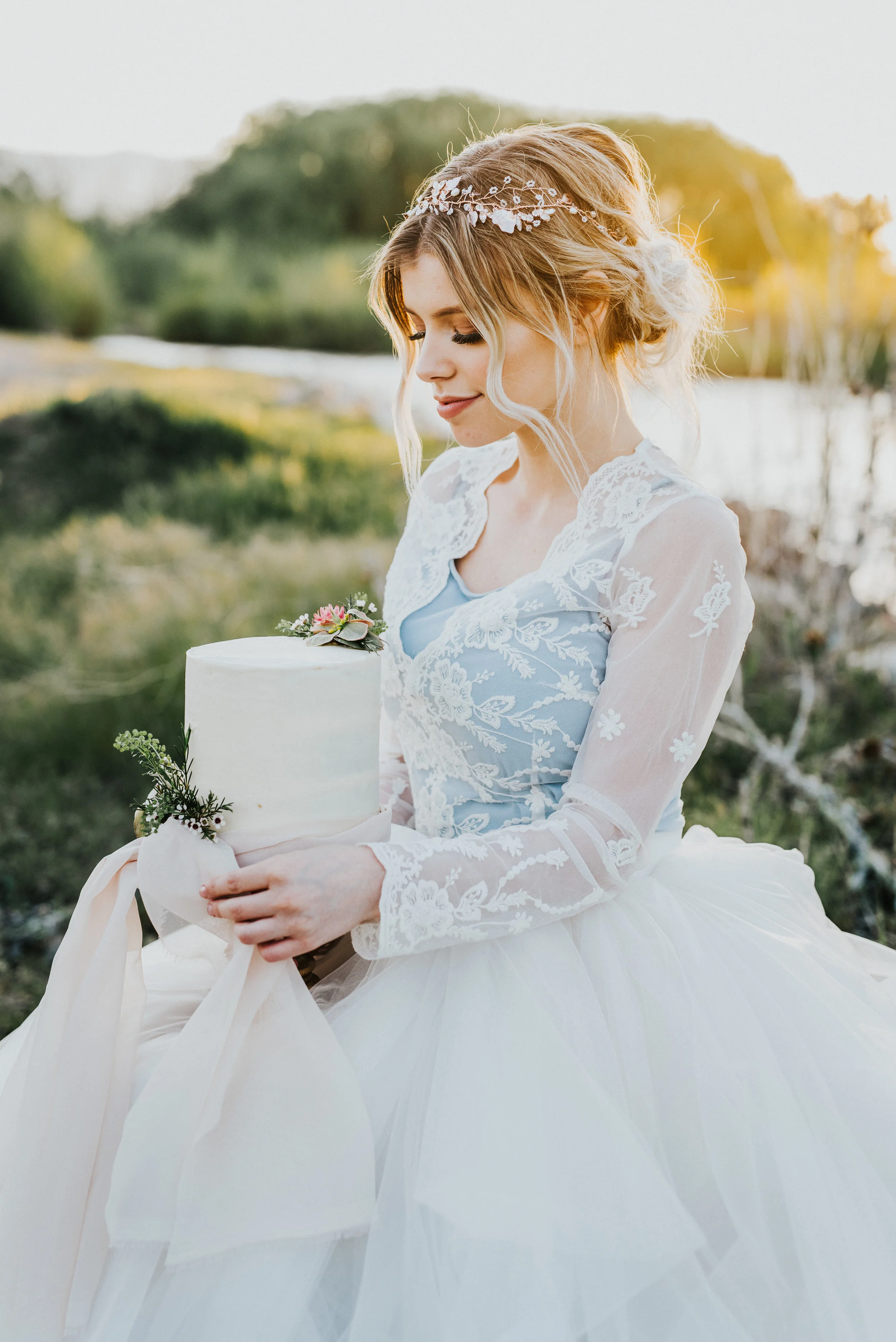  styled shoot focus collective workshop logan utah bridal session wedding day hair and makeup wedding hairpiece inspo wedding dress inspo unique wedding dress blue and white wedding dress lace wedding dress ball gown wedding cake bridal posing ideas 