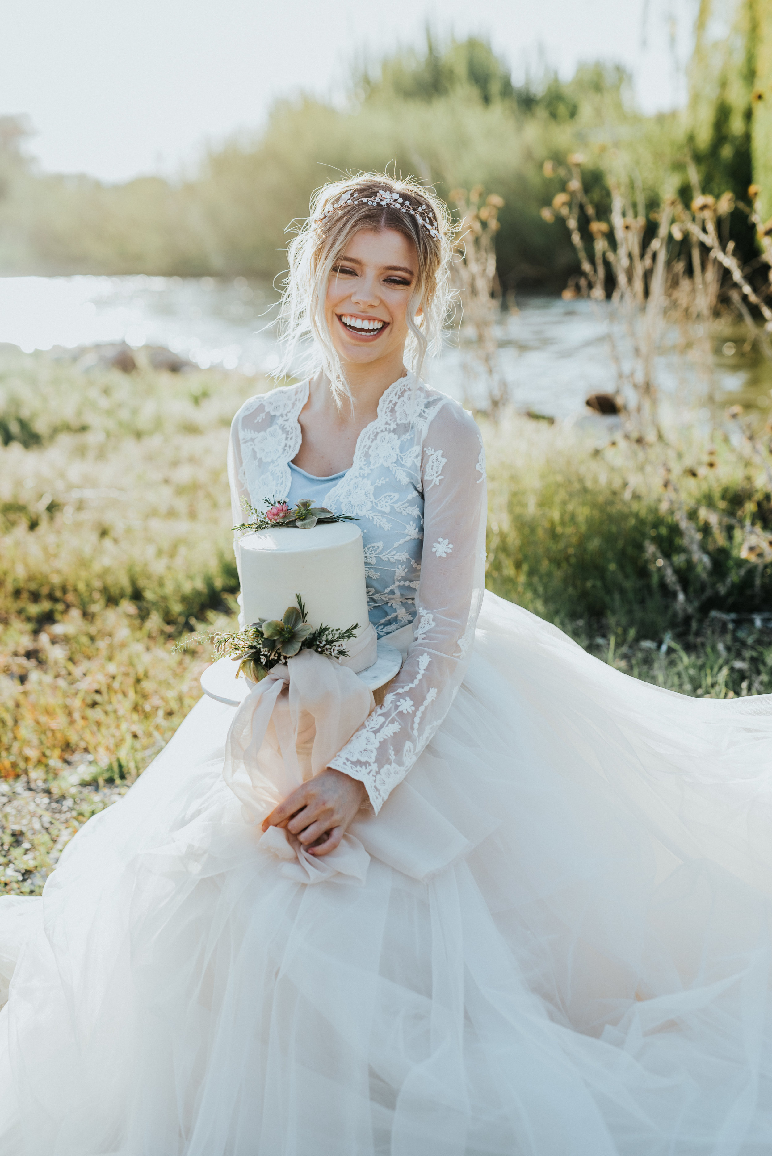  The focus collective workshop logan utah logan utah wedding photographer utah photographer bridal session bridal styled shoot mock bridals ball gown wedding dress blue and white wedding dress lace wedding dress bridal posing ideas bride holding cake