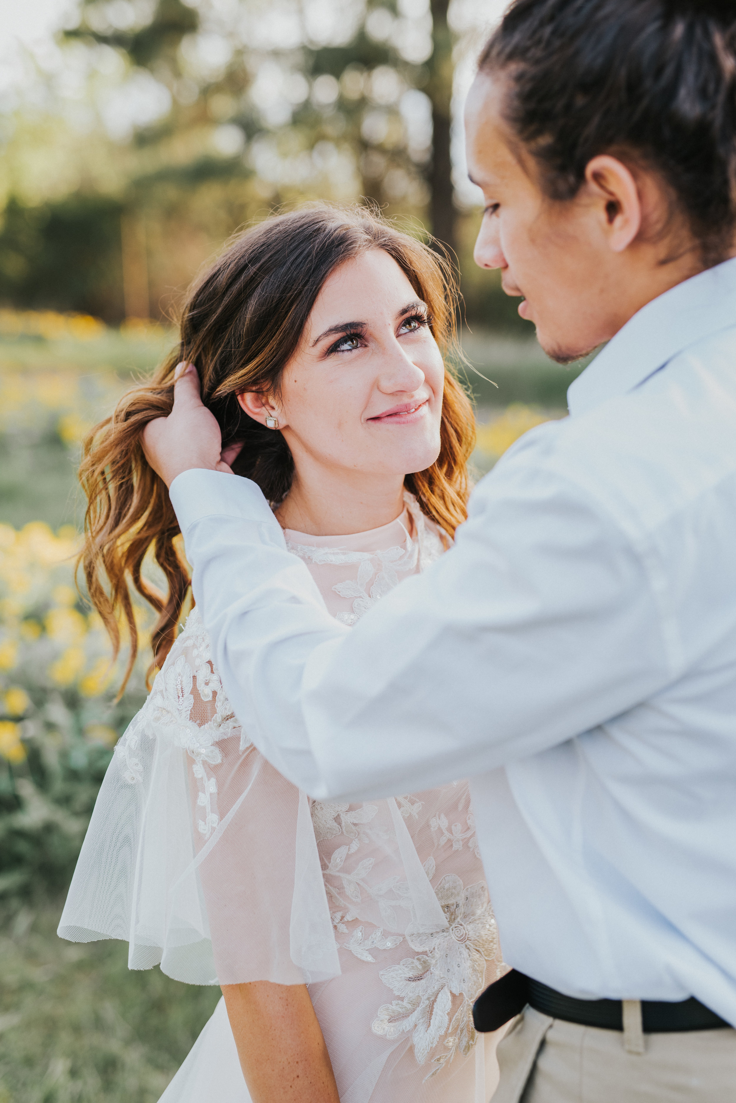  the focus collective workshop logan utah wedding photographer wedding pictures bride and groom wedding dress romantic couple wedding hair inspo wedding makeup inspo styled shoot bridal shoot couple posing ideas groom brushing hair back wedding jewel