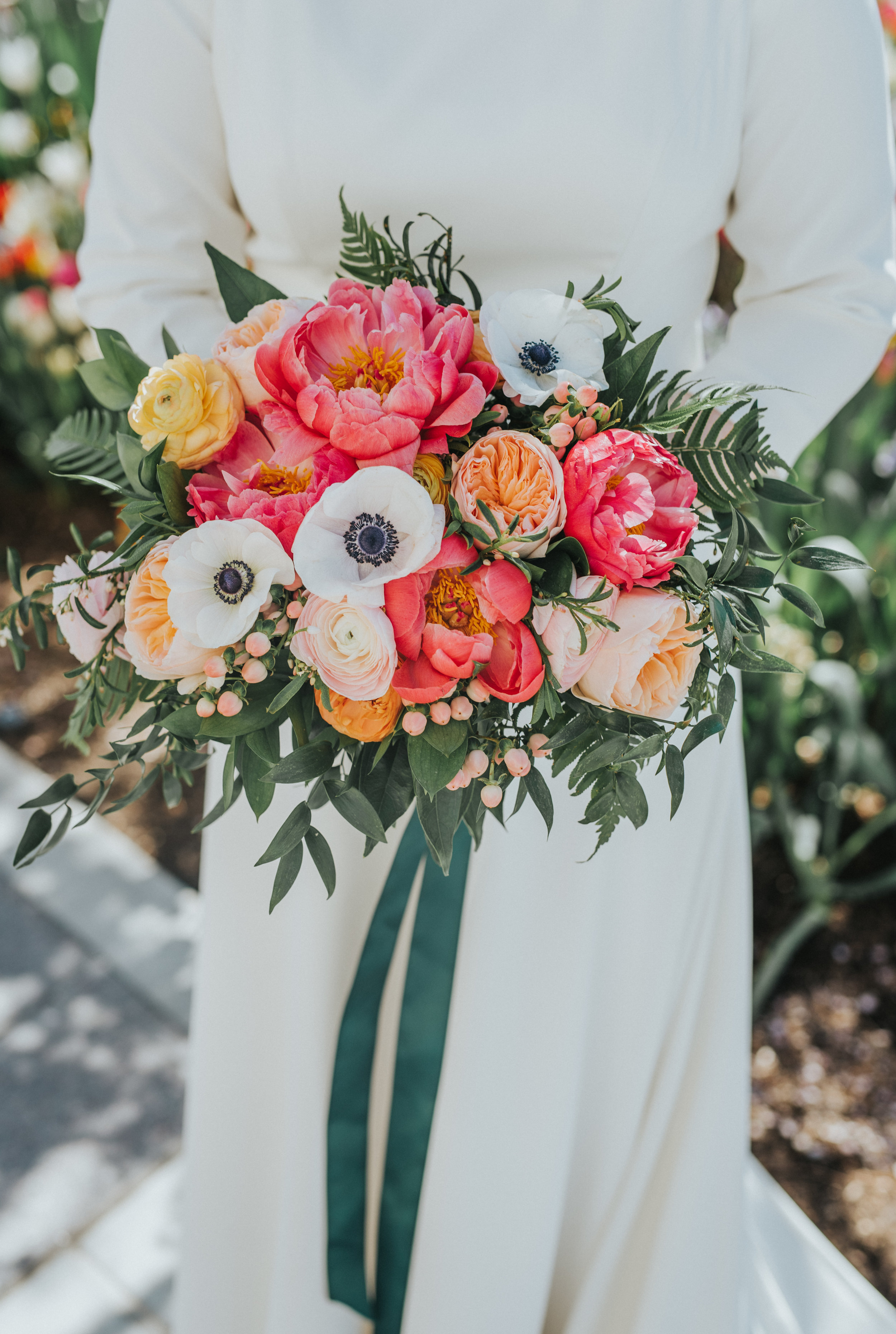  messy poppy flower pink and peach floral wedding bouquet emerald green bouquet ribbon modest wedding dress three quarter sleeved dress payson utah temple wedding grounds best payson utah wedding photographer #professionalutahphotographer #paysonutah