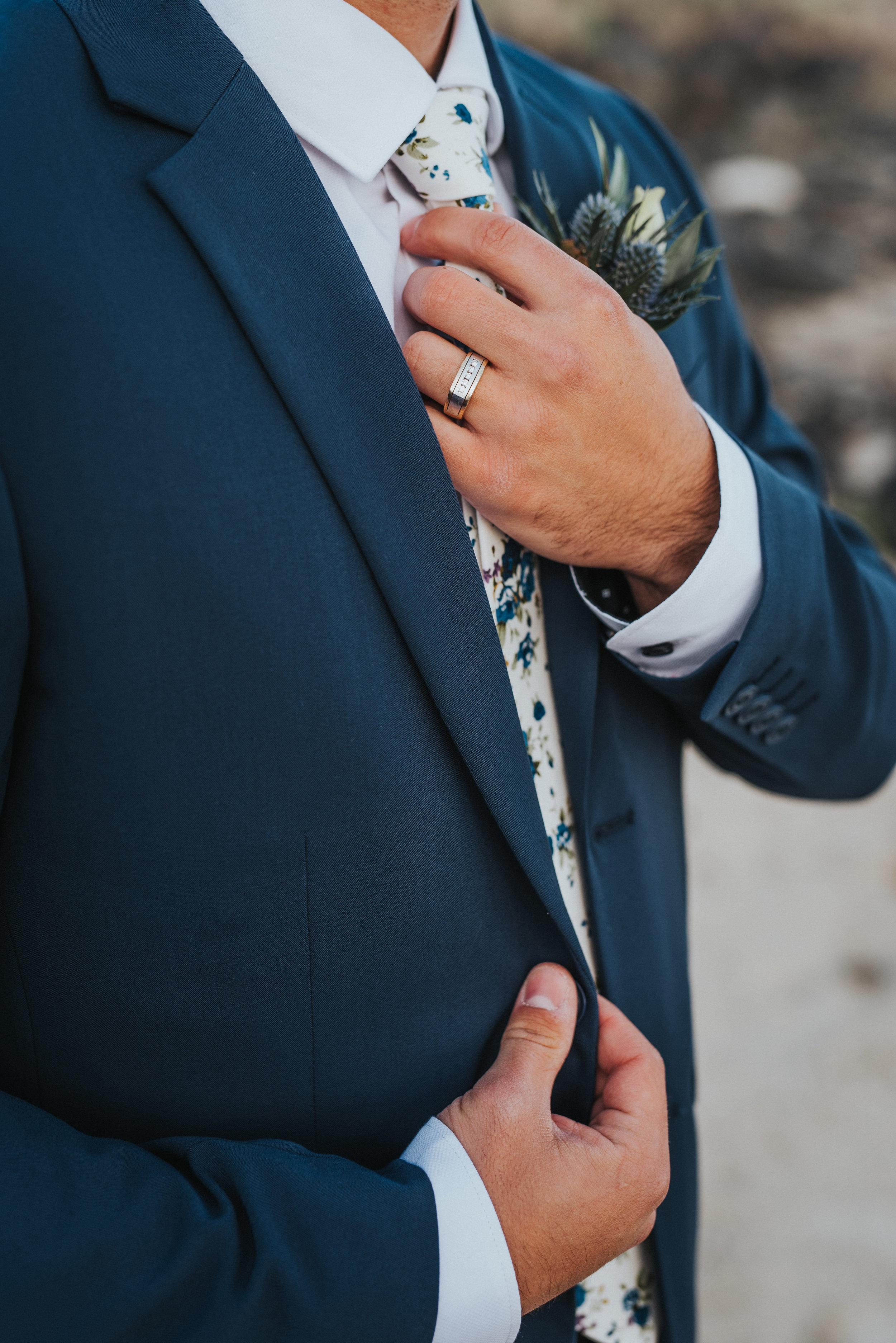  navy wedding suit groom adjusting floral tie great salt lake first look wedding photos formal bridals northern utah wedding photographer #spiraljetty #saltlakecityweddingphotographer #saltlake #ido #northernutahphotographer #bridals #weddinginsp #ha