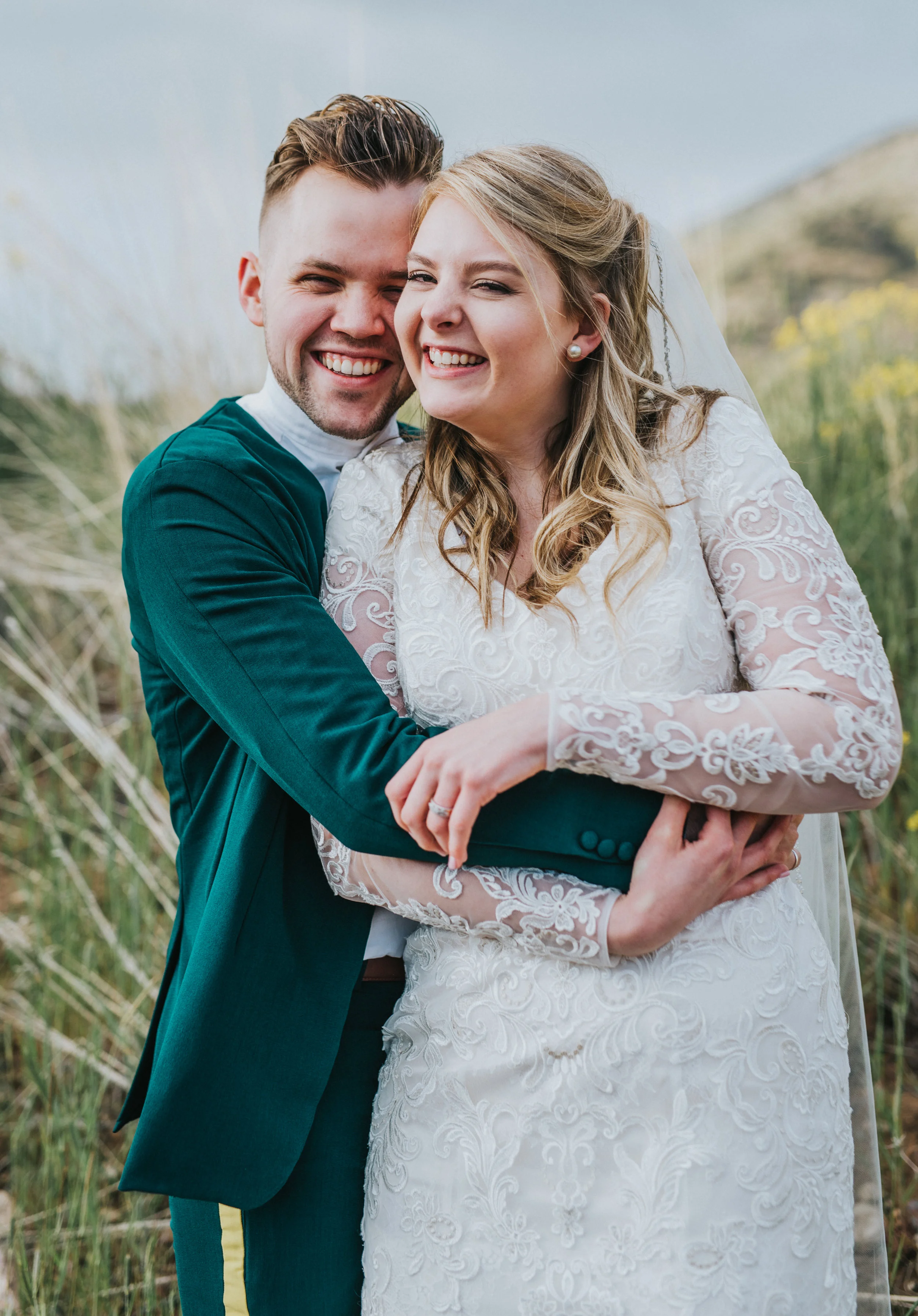  tall grass hyrum reservoir cuddling hugging laughing playful authentic photography poses northern utah wedding photographer logan utah mountain backdrop cache valley photo locations #cachevalleyutah #hyrumutah #northernutahphotographer #bridals #hyr