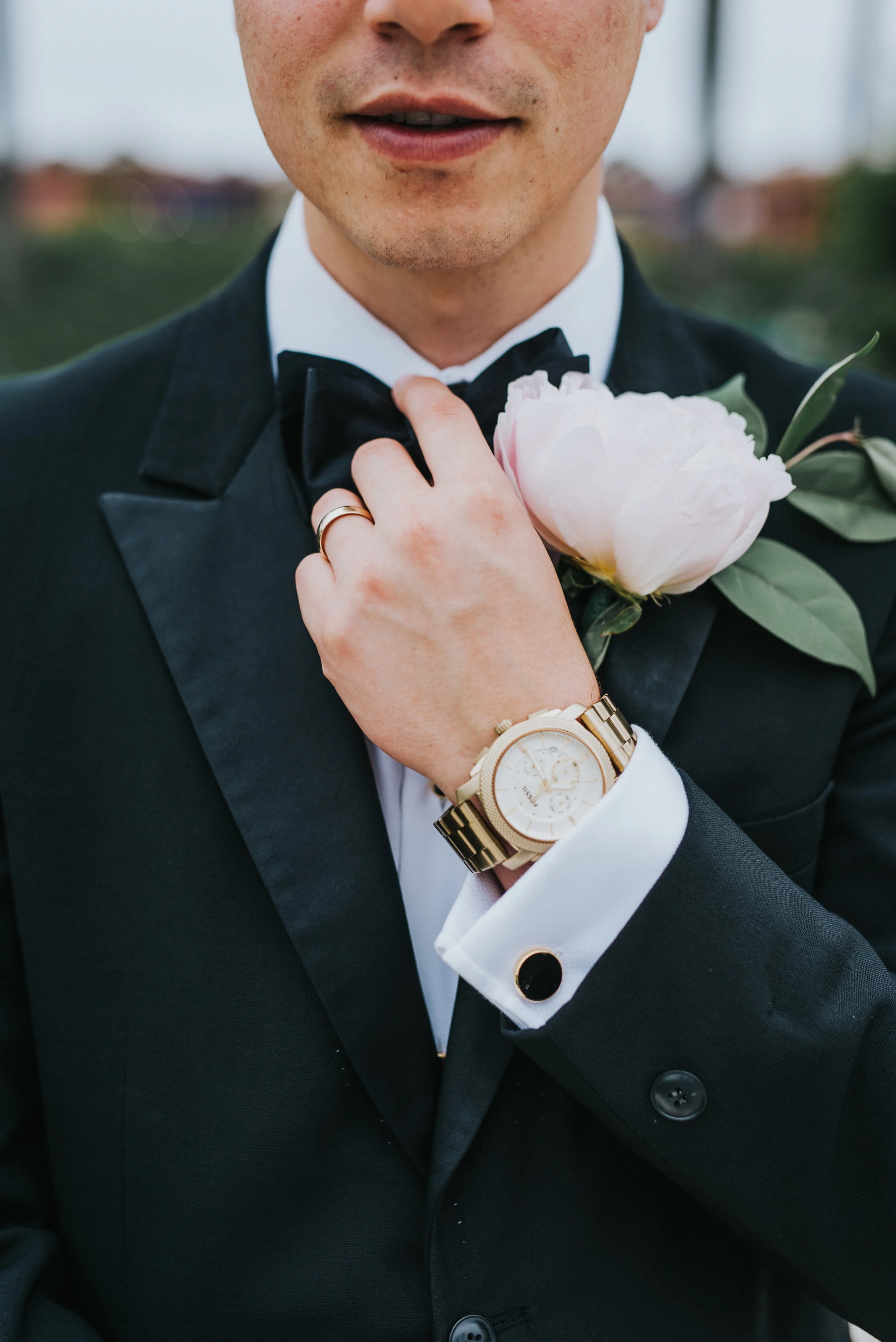  adjusting wedding bow tie black cufflink black wedding suit groom pink peony boutonnière formals san diego wedding photographer san diego temple lds groom #lajollacaliforniaweddingphotographer #sandiegotemple #windanseabeachcalifornia #northernutahw