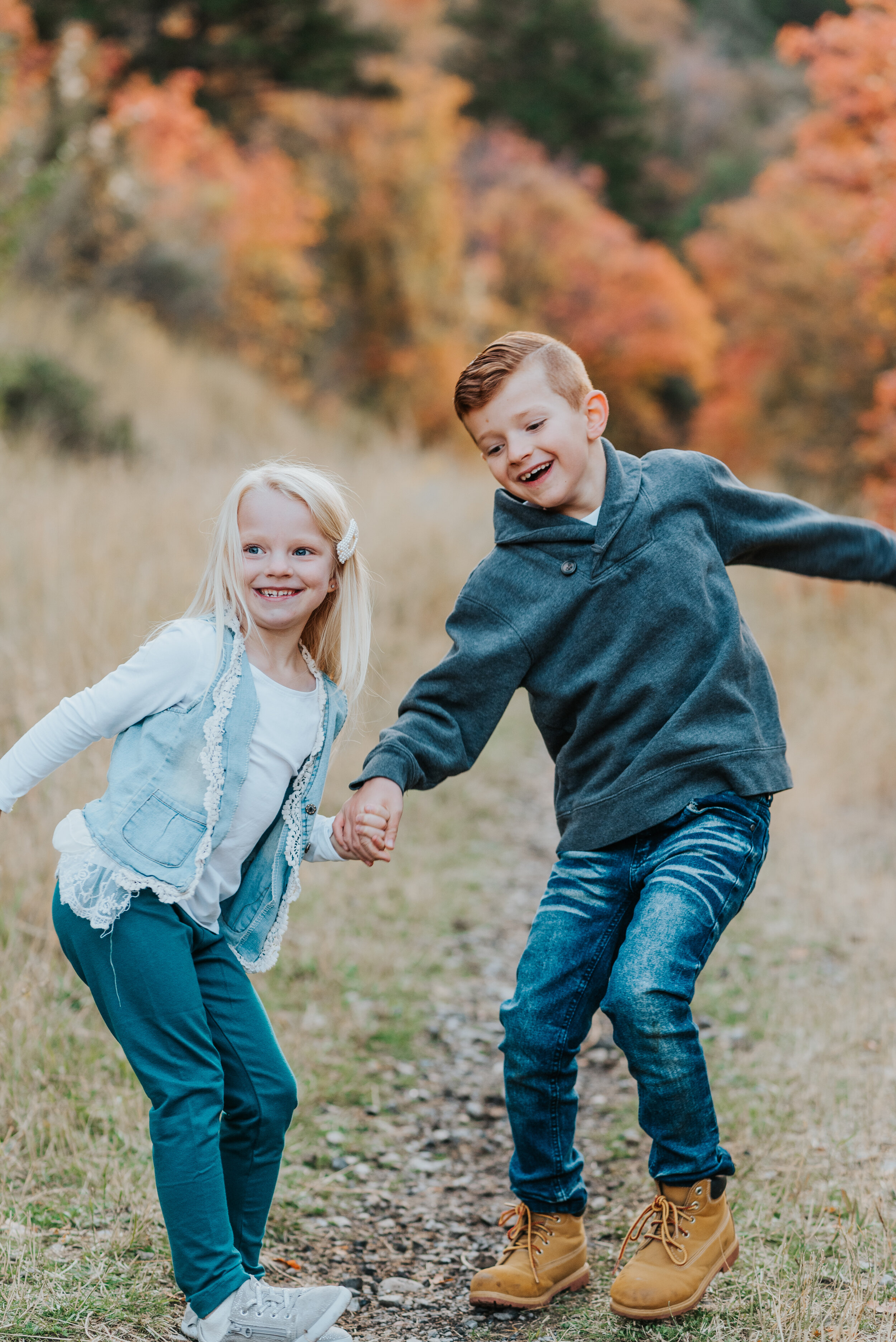  fall family photos candid photos cache valley family photographer candid photos best friends sibling pictures brother and sister playing together siblings holding hands siblings walking together kids photography kids outfit inspo fall time colorful 