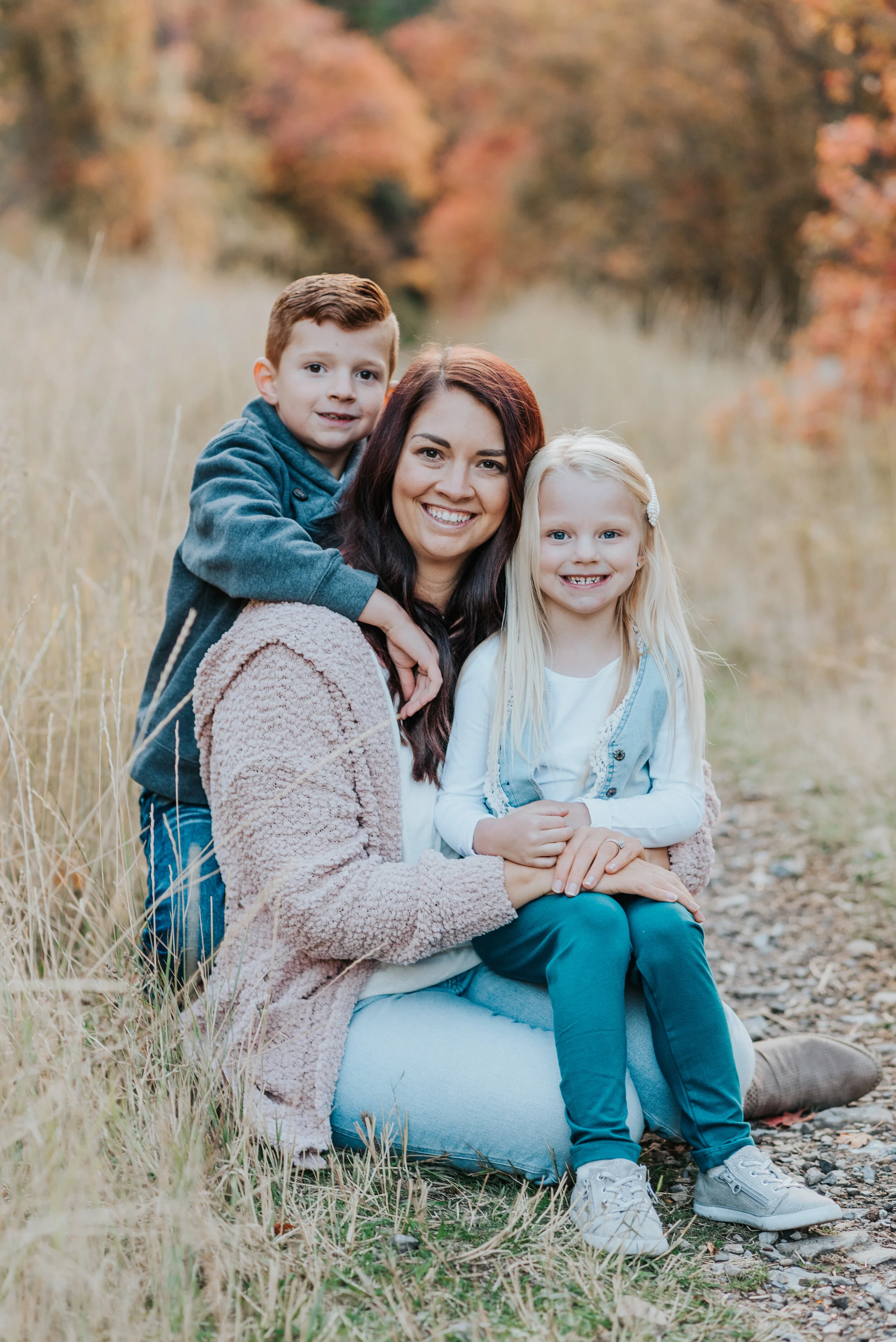  fall family photos cache valley family photography mom and kids smiling at camera happy moment candid moments brother and sister siblings fall colors what to wear to family photos fall family outfit inspo lots of love family of three posing ideas #c
