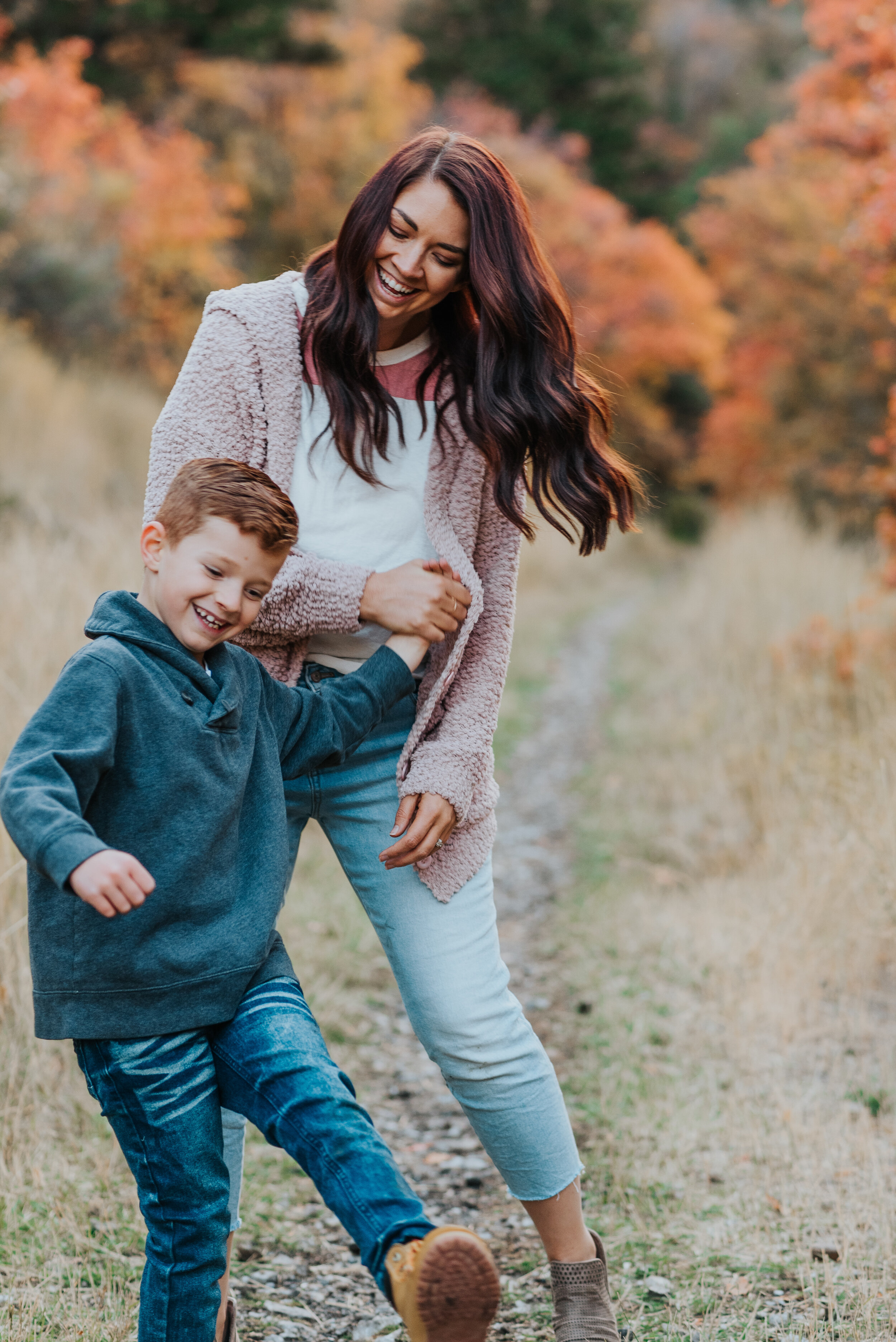  utah family photographer cache valley mom and son walking together family posing ideas family posing inspiration what to wear to family photos happy moments family photos in the mountains fall colors fall outfit inspiration life moments laughing tog