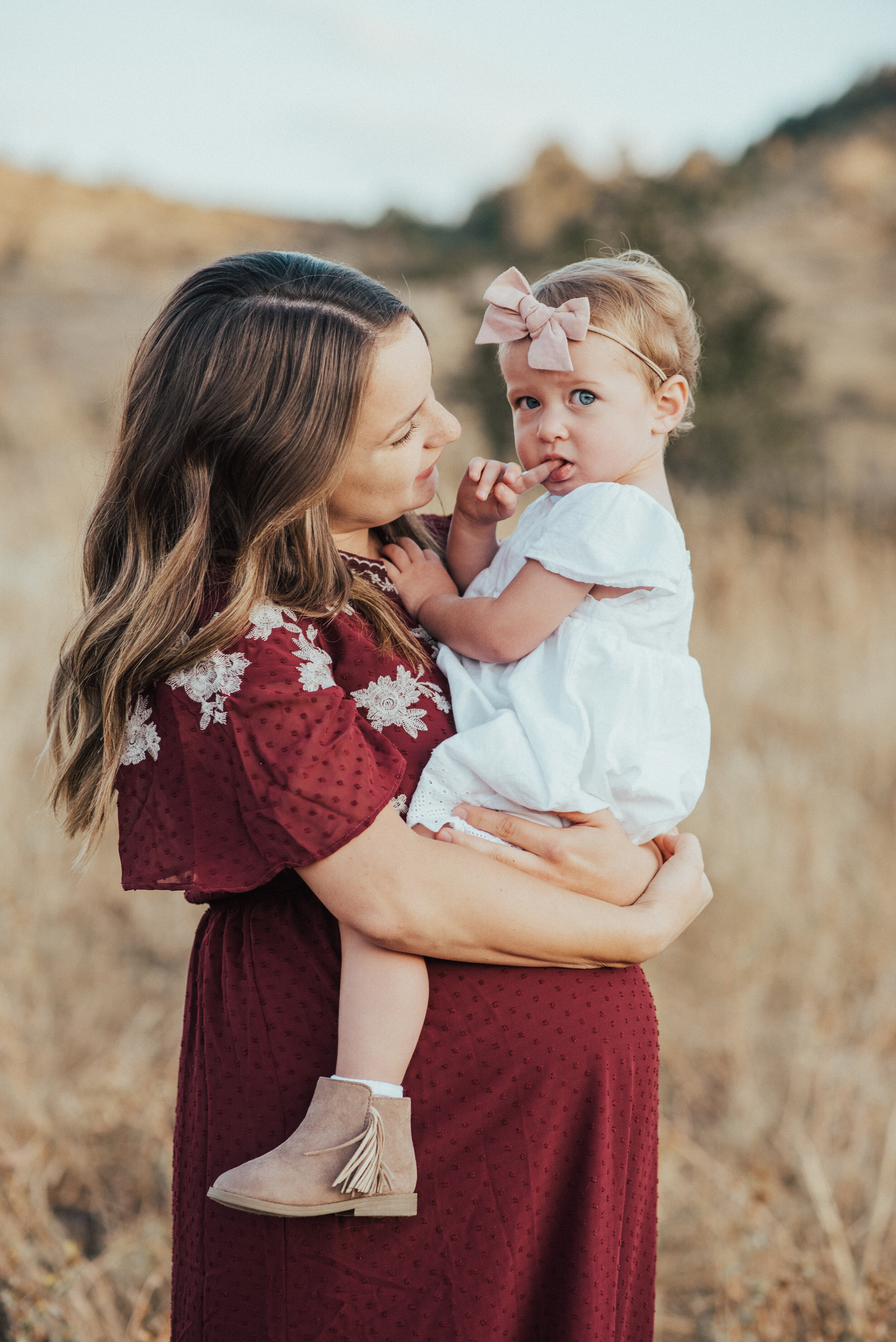  Mom with her baby fall family pictures maroon dress outfit inspiration for family pictures in logan utah with professional family photographer kristi alyse photo #maternityphotos #familyphotos #loganutahfamilyphotographer #kristialysephoto #northern