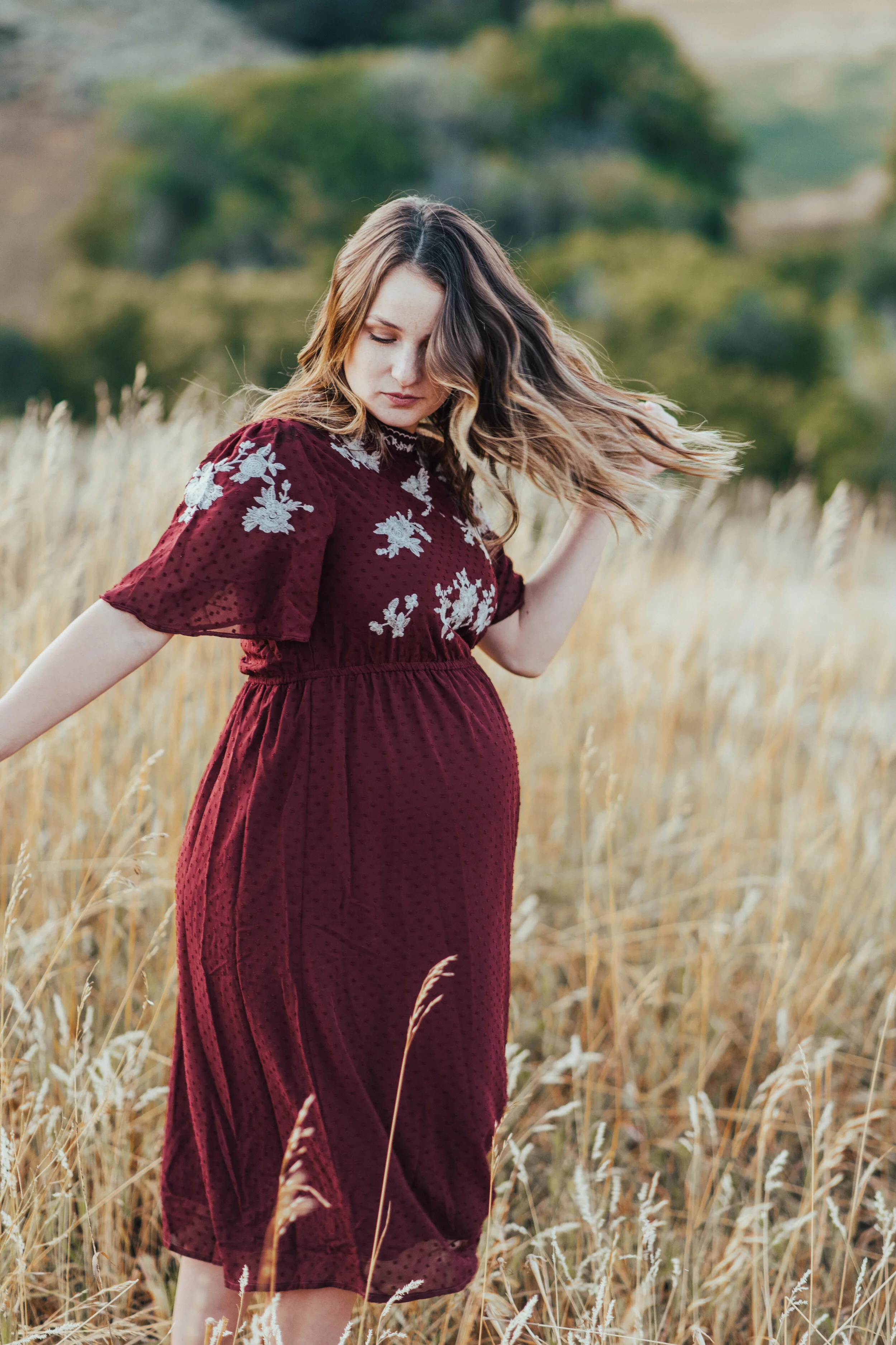  maternity photos in field northern utah maternity pictures family photographer logan utah cache valley fall family pictures outfit inspo red dress with flowy sleeves #maternityphotos #familyphotos #loganutahfamilyphotographer #kristialysephoto #nort