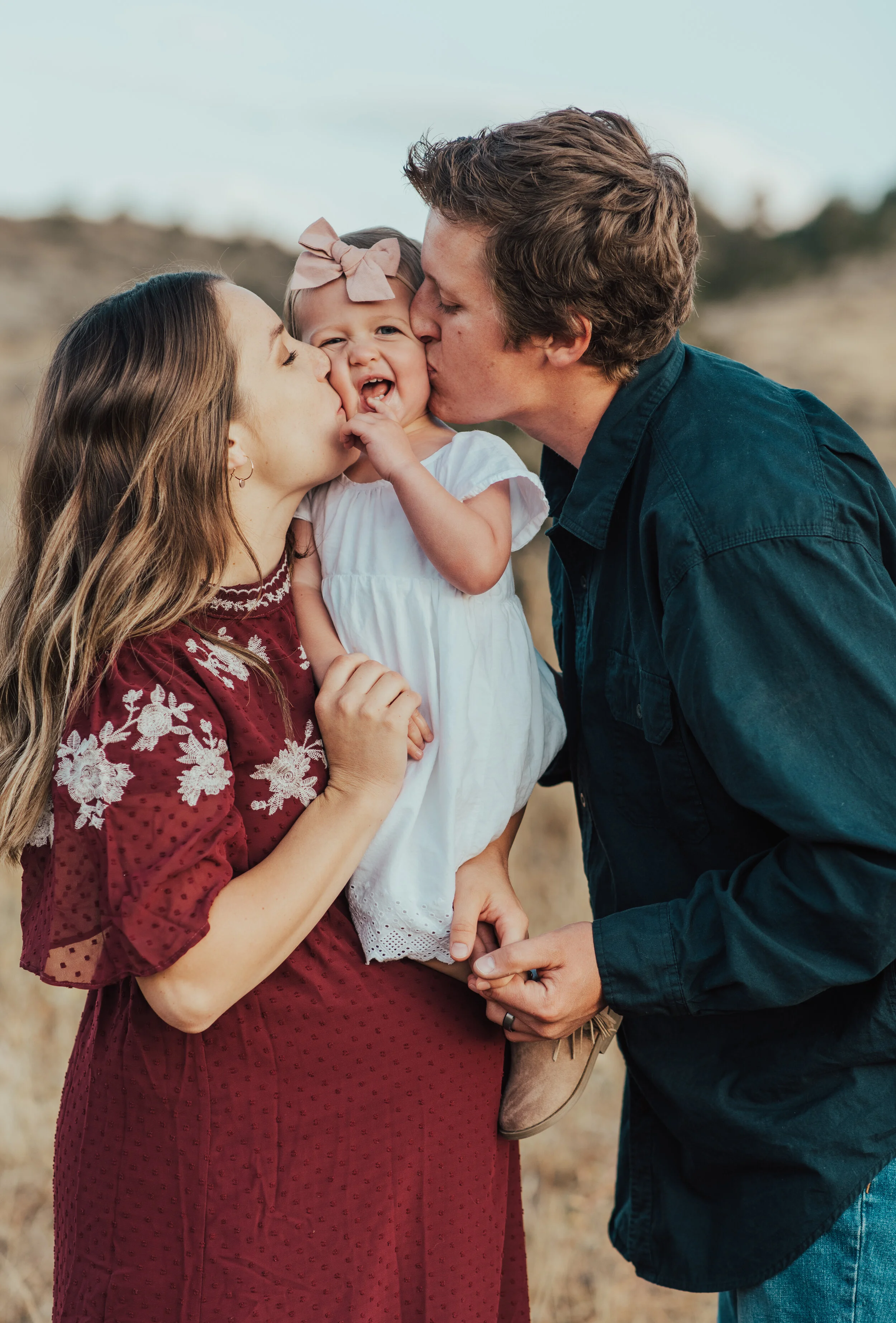  family pictures mom and dad kissing baby young small family pictures fine art family photographer logan utah professional photographer kristi alyse photo #maternityphotos #familyphotos #loganutahfamilyphotographer #kristialysephoto #northernutahfami