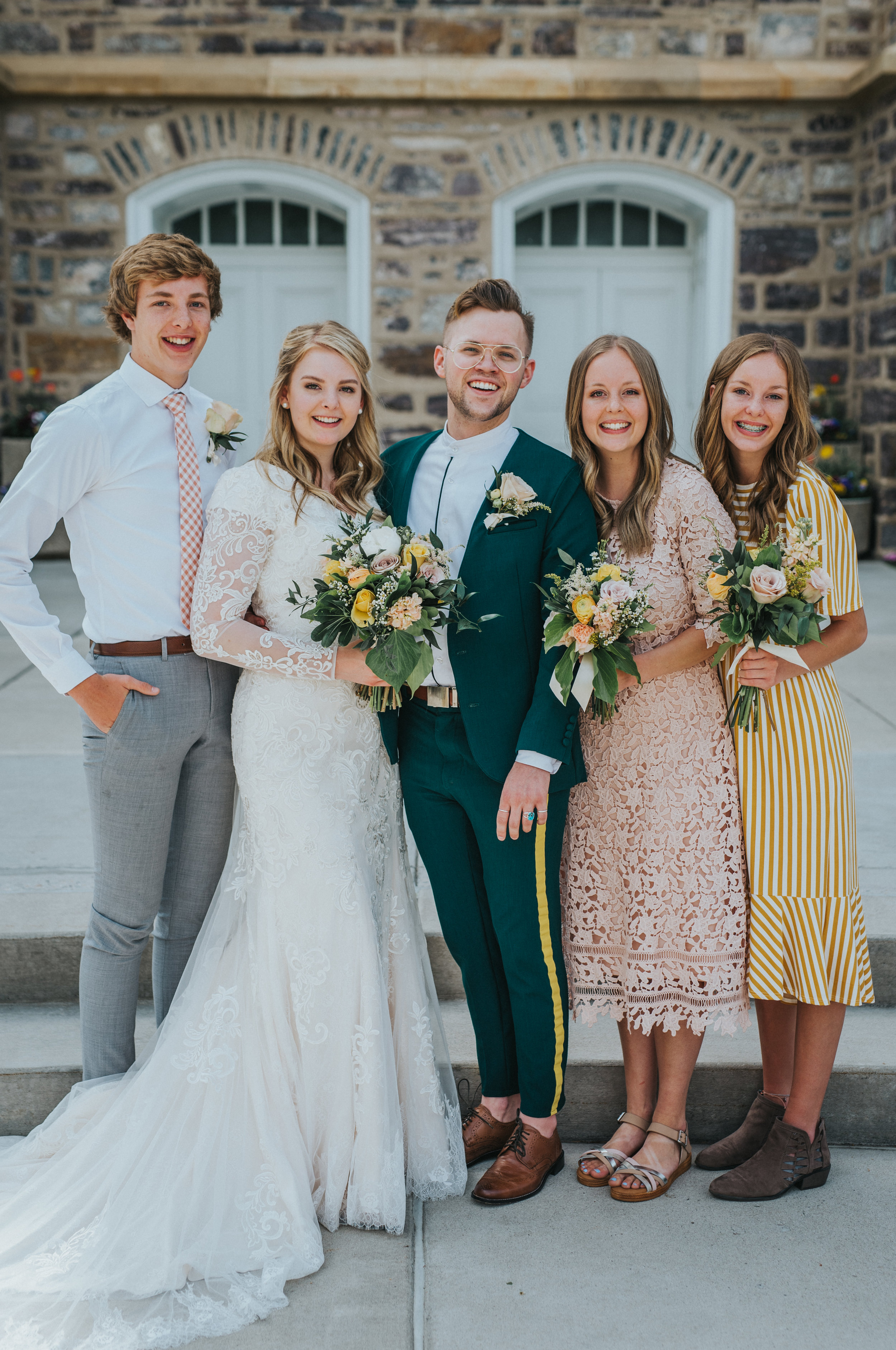  just married logan utah lds temple sibling photo happy smiling celebrating bride groom retro green wedding suit modest lace long sleeved dress professional logan utah wedding photographer #StationStudio #WeddingCeremony #Loganutahtemple #FreckleFarm