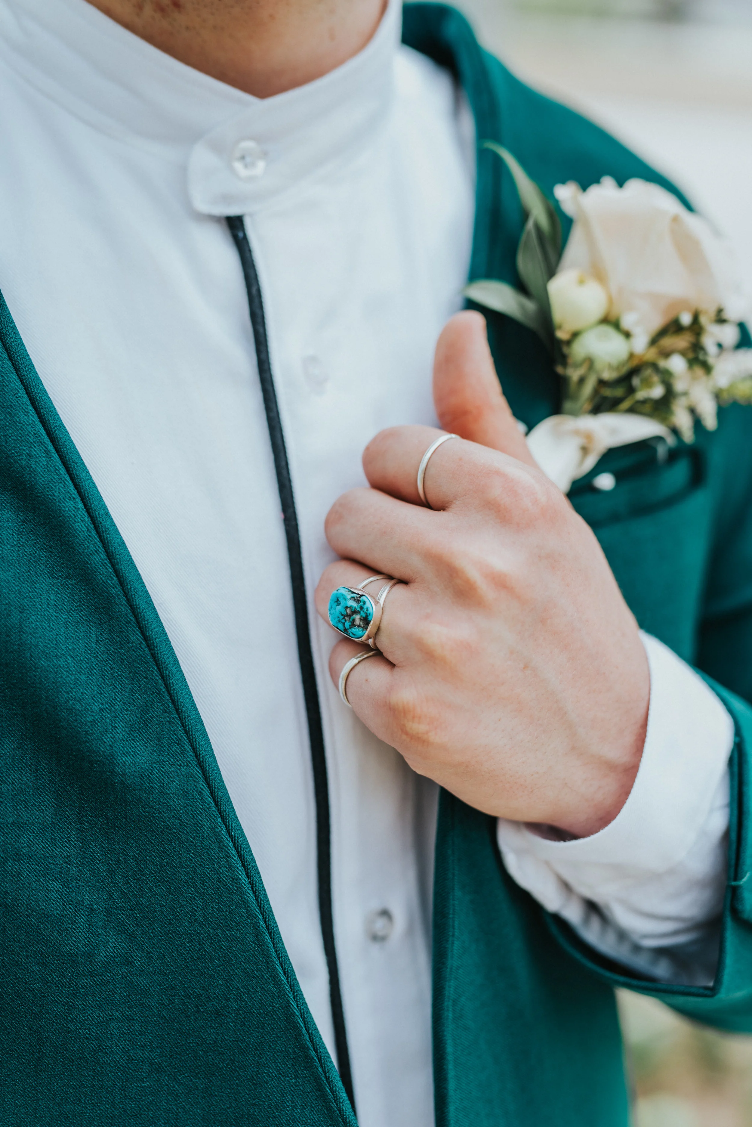  emerald green wedding suit retro mens silver rings turquoise mens ring white rose boutonniere professional logan utah wedding photographer black and white dress shirt #StationStudio #WeddingCeremony #Loganutahtemple #FreckleFarm #cachevalleyutah #ut