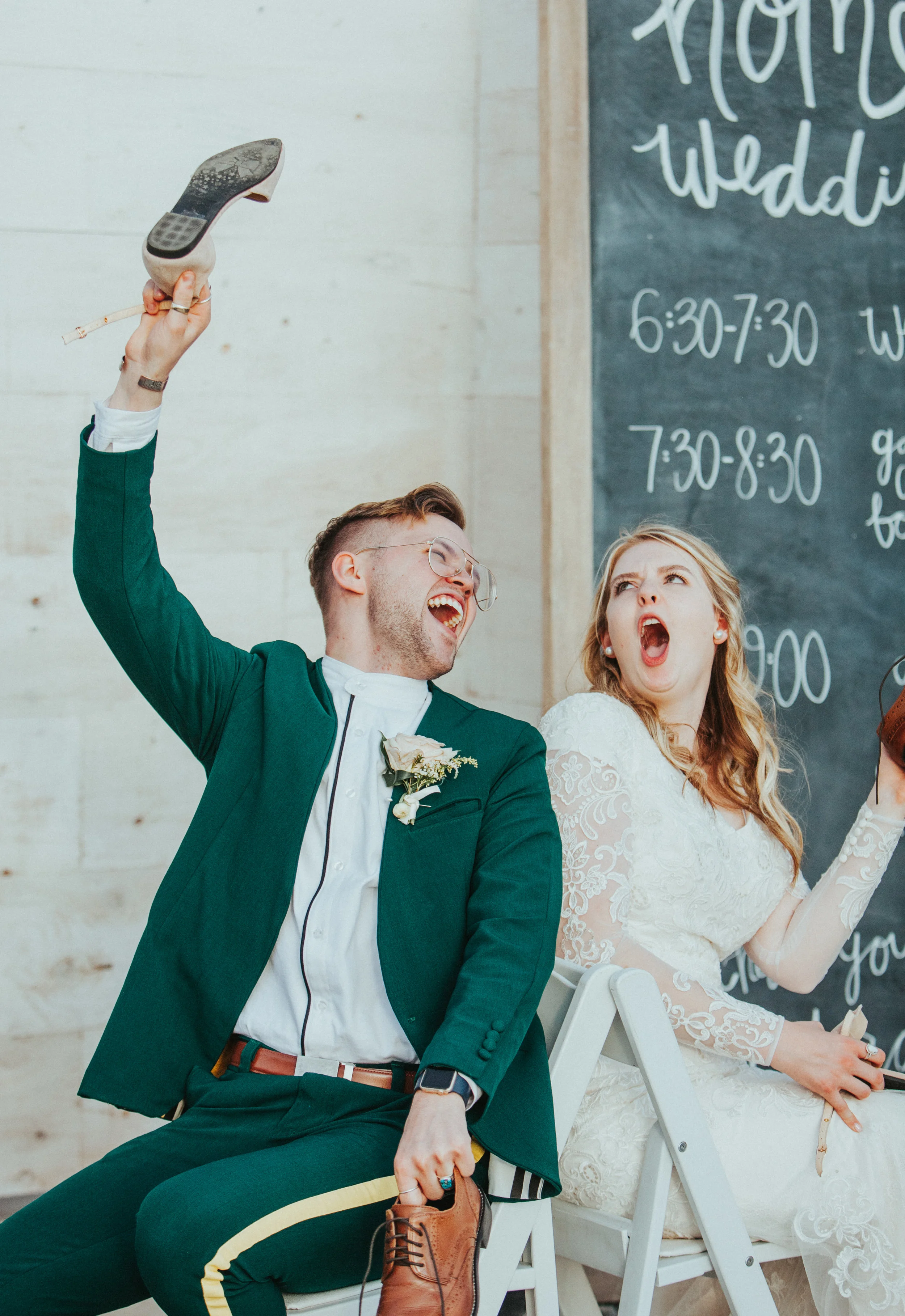  shoe in the air chalkboard wedding decor freckle farm outdoor wedding reception emerald green wedding suit retro vintage mens glasses brown leather belt wedding shoes modest lace long sleeved wedding dress professional logan wedding photographer whi