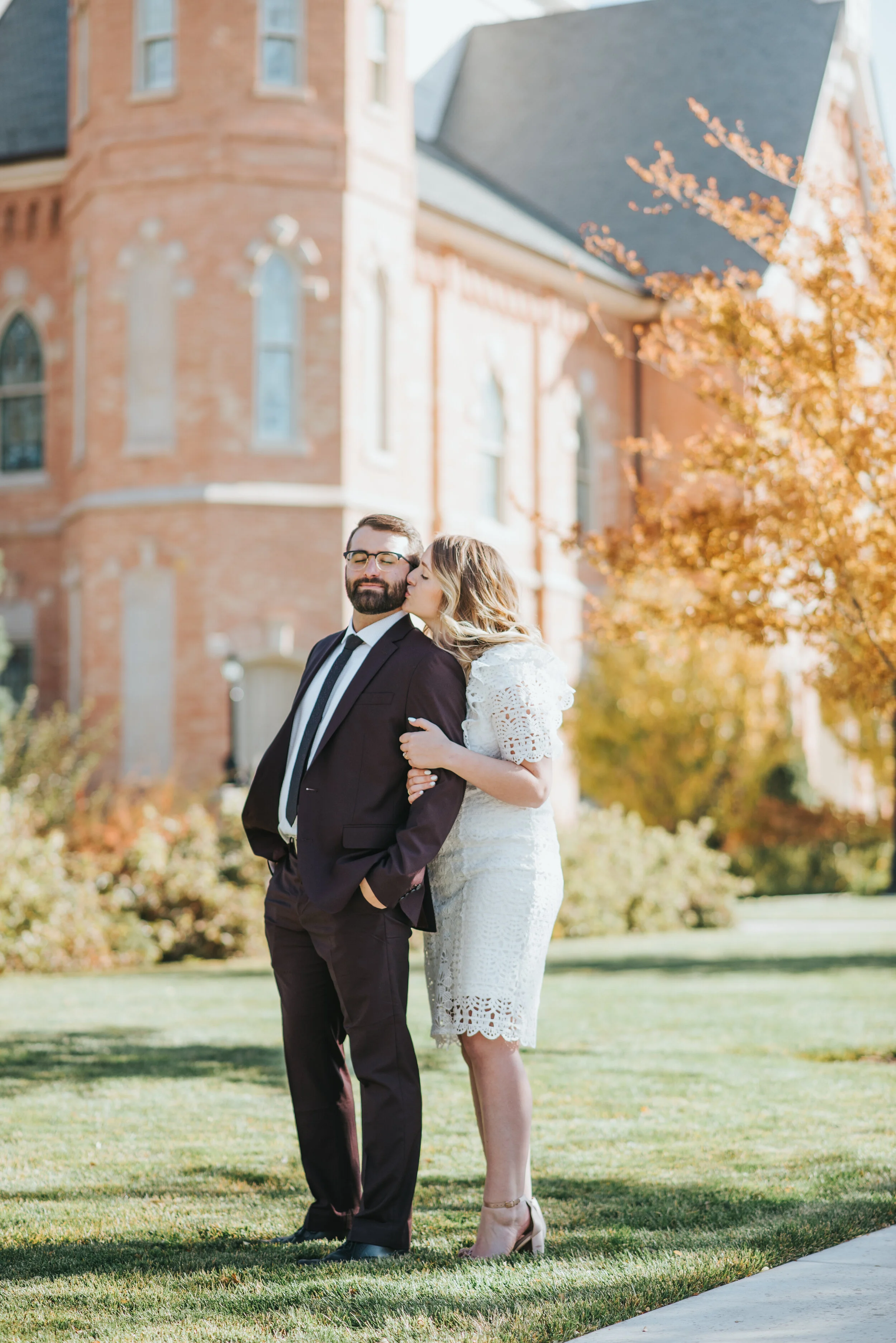  provo city center temple wedding just married sealed lds burgundy wedding suit black tie knee length short sleeved lace wedding dress nude heels loose curled wedding hair wedding inspiration utah valley professional wedding photographer #utahvalleyw
