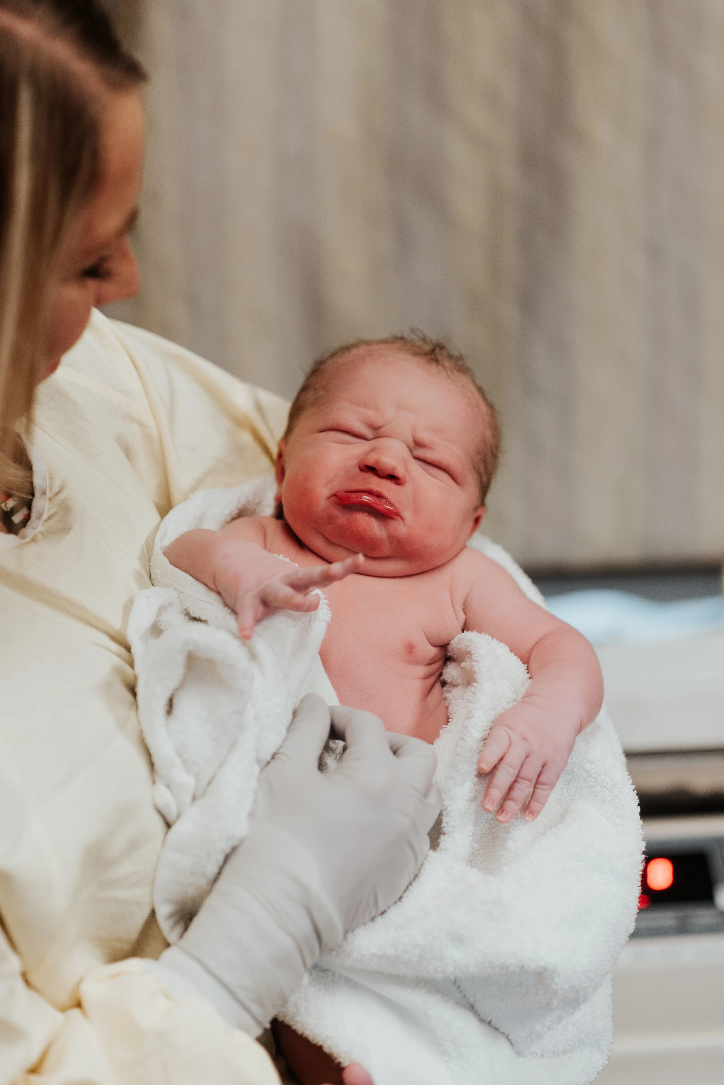  Beautiful newborn baby boy with lots of hair in the arms of his beautiful mama. birth photo session newborn photographer in cache valley logan utah professional birth story photographer hospital pictures of a brand new baby #kristialysephotography #