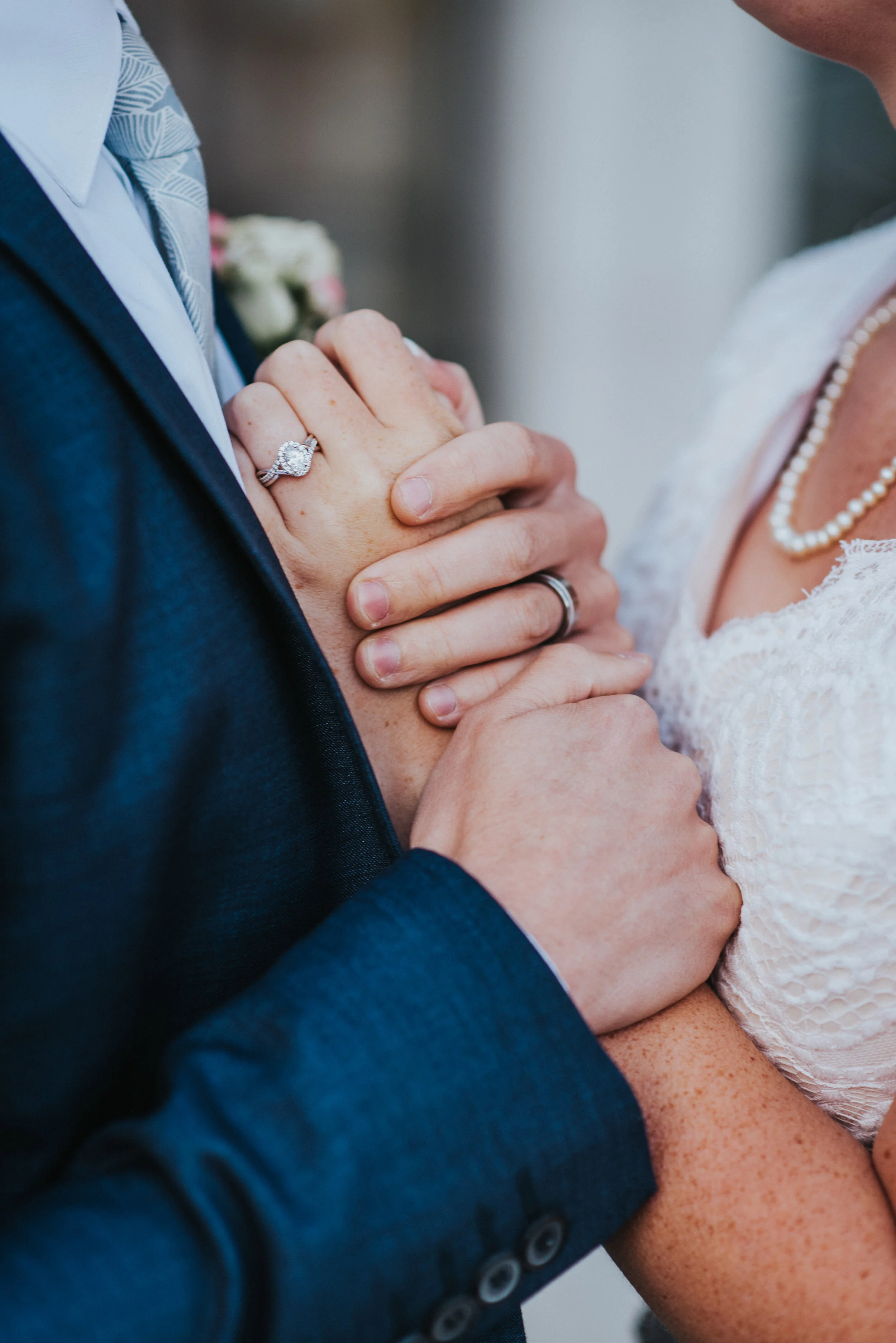 holding_hands_wedding_rings.jpeg