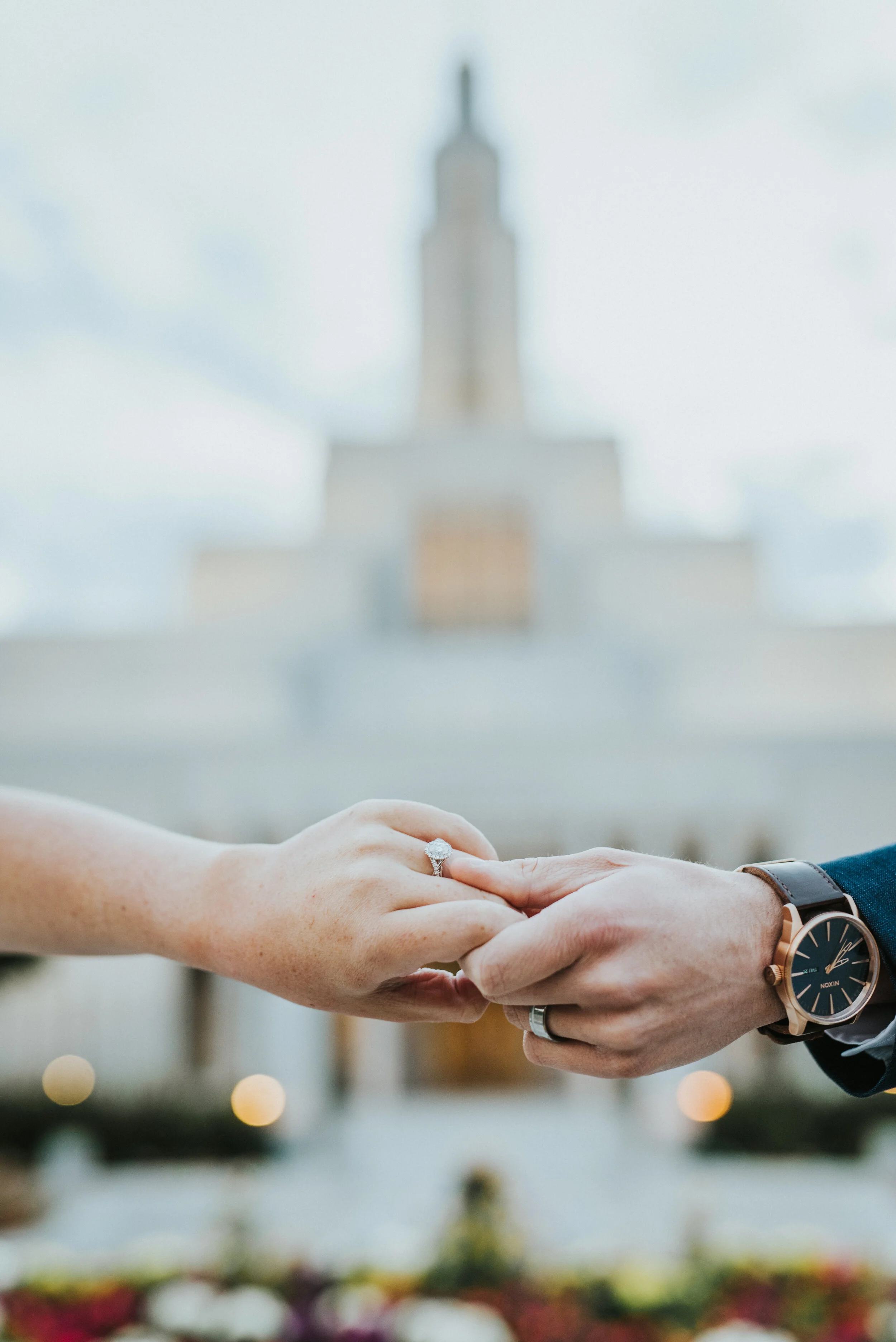 holding_hands_with_temple_in_background.JPG