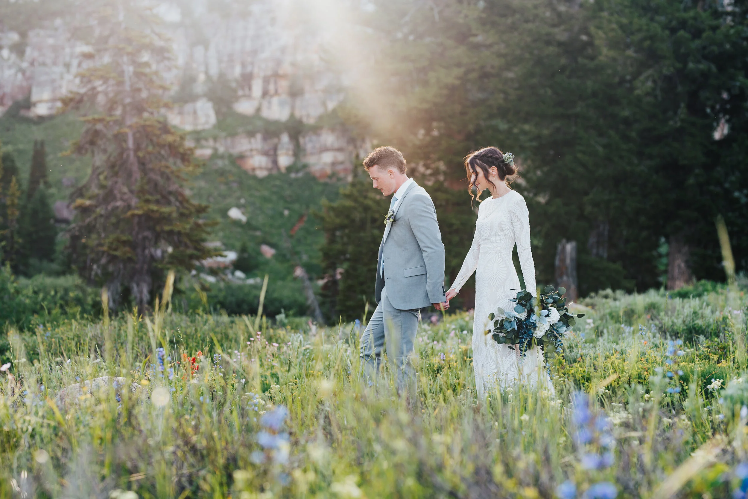 Stunning formals in the middle of a wild flower filled meadow up Logan canyon. Kristi Alyse photography Logan Utah wedding photographer forest nature dreamy formals Logan canyon Tony Grove scenic bridals Northern Utah photographer Utah brides bride …