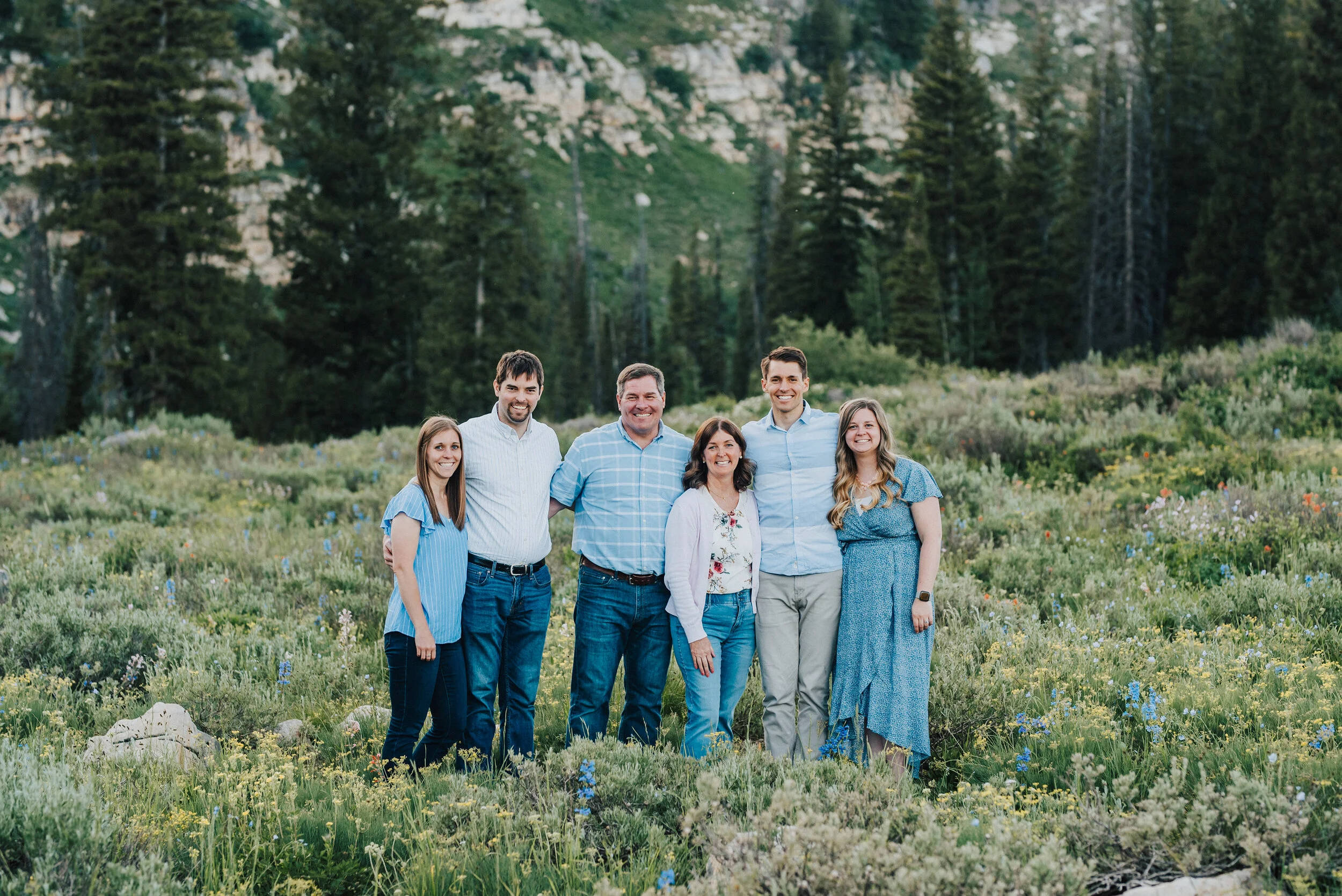 Scenic family photoshoot up Logan Canyon at Tony Grove. Logan Utah family photographer Kristi Alyse photography Tony Grove forest nature photos Logan canyon light blue family photos wild flowers grand parents children parents spouses reunited dreamy…