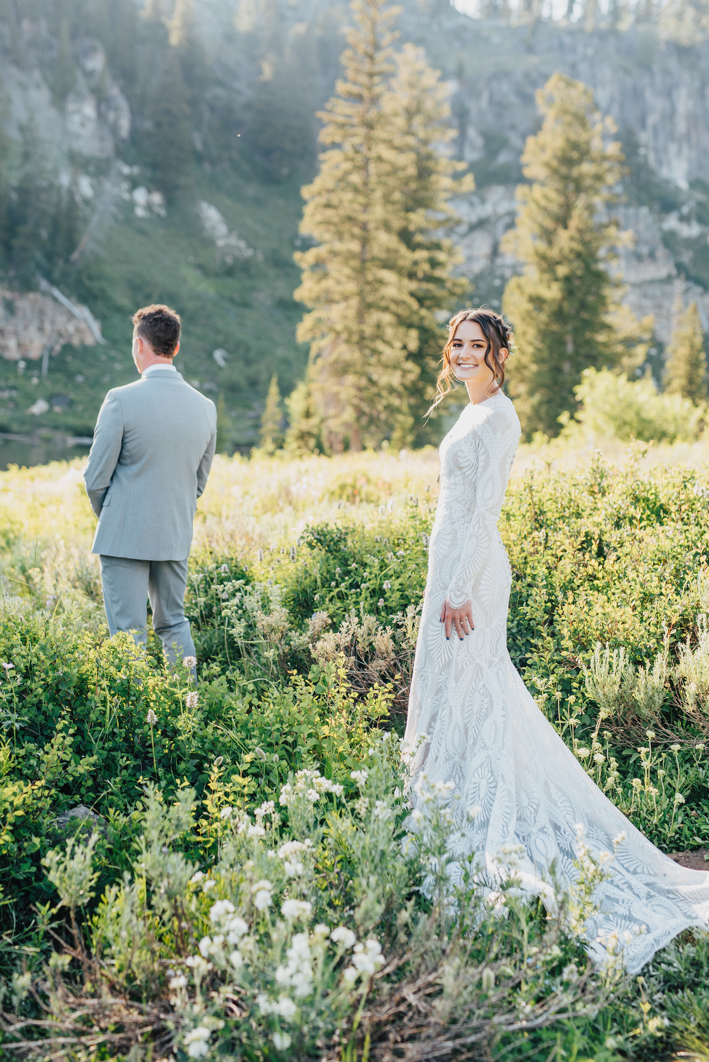 Gorgeous bride and groom during their first look surrounded by lush forest up Logan canyon. Kristi Alyse photography Logan Utah wedding photographer forest nature dreamy formals Logan canyon Tony Grove scenic bridals Northern Utah photographer Utah brides bride and groom Cache Valley #kristialysephotography #loganutahphotographer #tonygrove #logancanyon #utahweddingphotographer #bridals #formals #wildflowers #northernutah #utahbrides