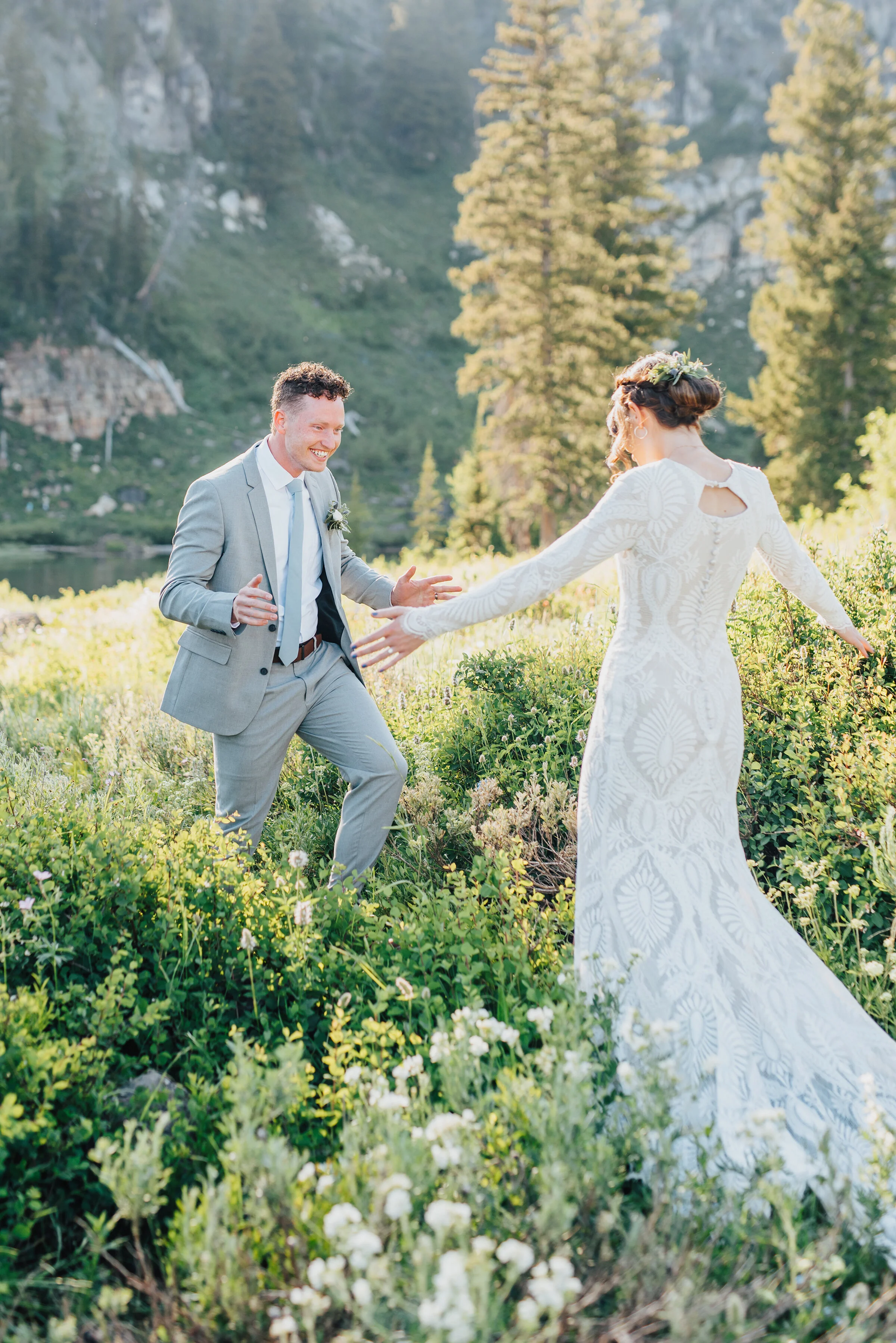  Joyful bride and groom in a dreamy meadow up Logan canyon for their first look. Kristi Alyse photography Logan Utah wedding photographer forest nature dreamy formals Logan canyon Tony Grove scenic bridals Northern Utah photographer Utah brides bride