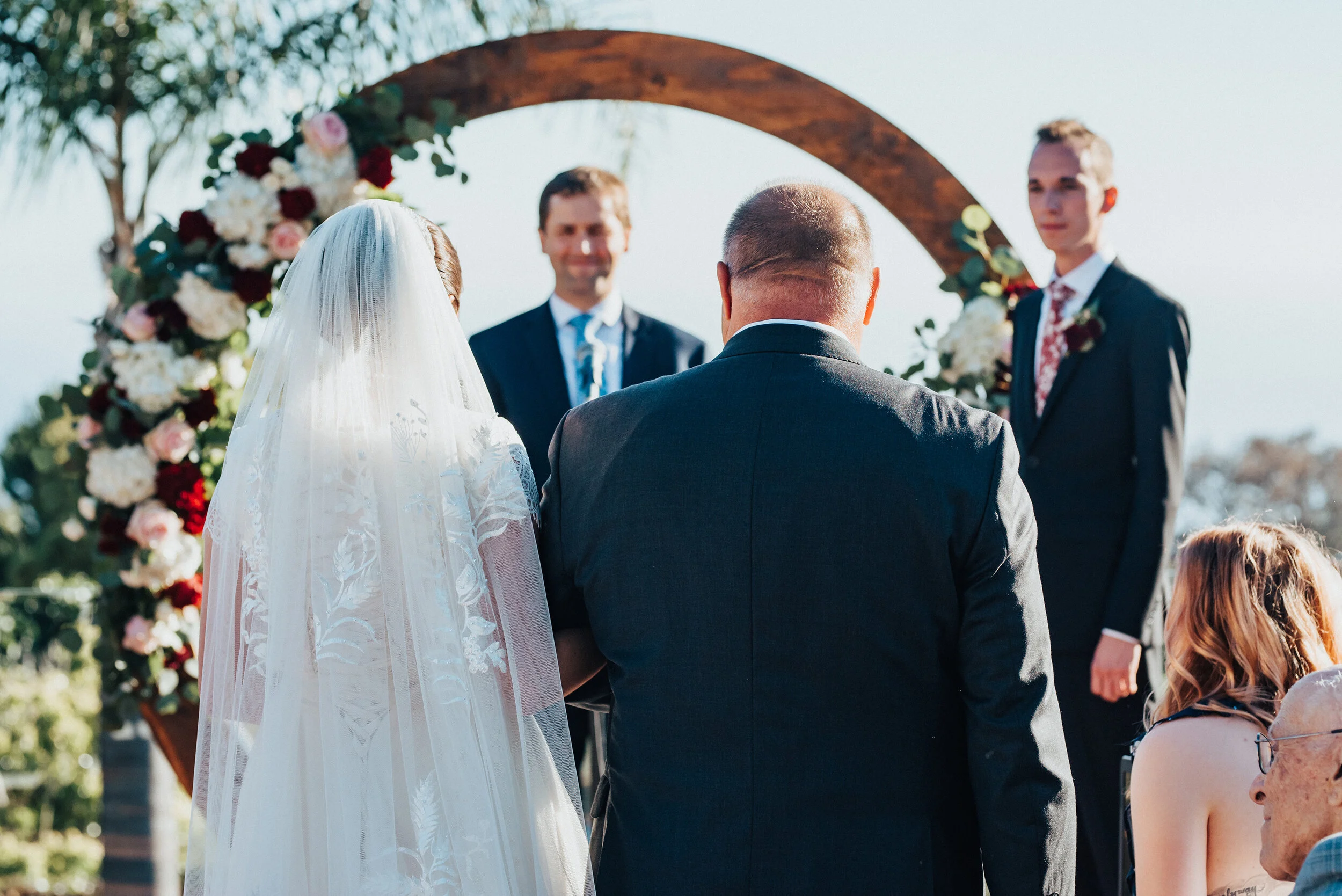 Father of the bride walking his daughter to her groom at this lovely backyard wedding in Laguna Beach. Kristi Alyse photography Laguna Beach wedding California brides Logan Utah wedding photographer backyard wedding destination photographer covid we…