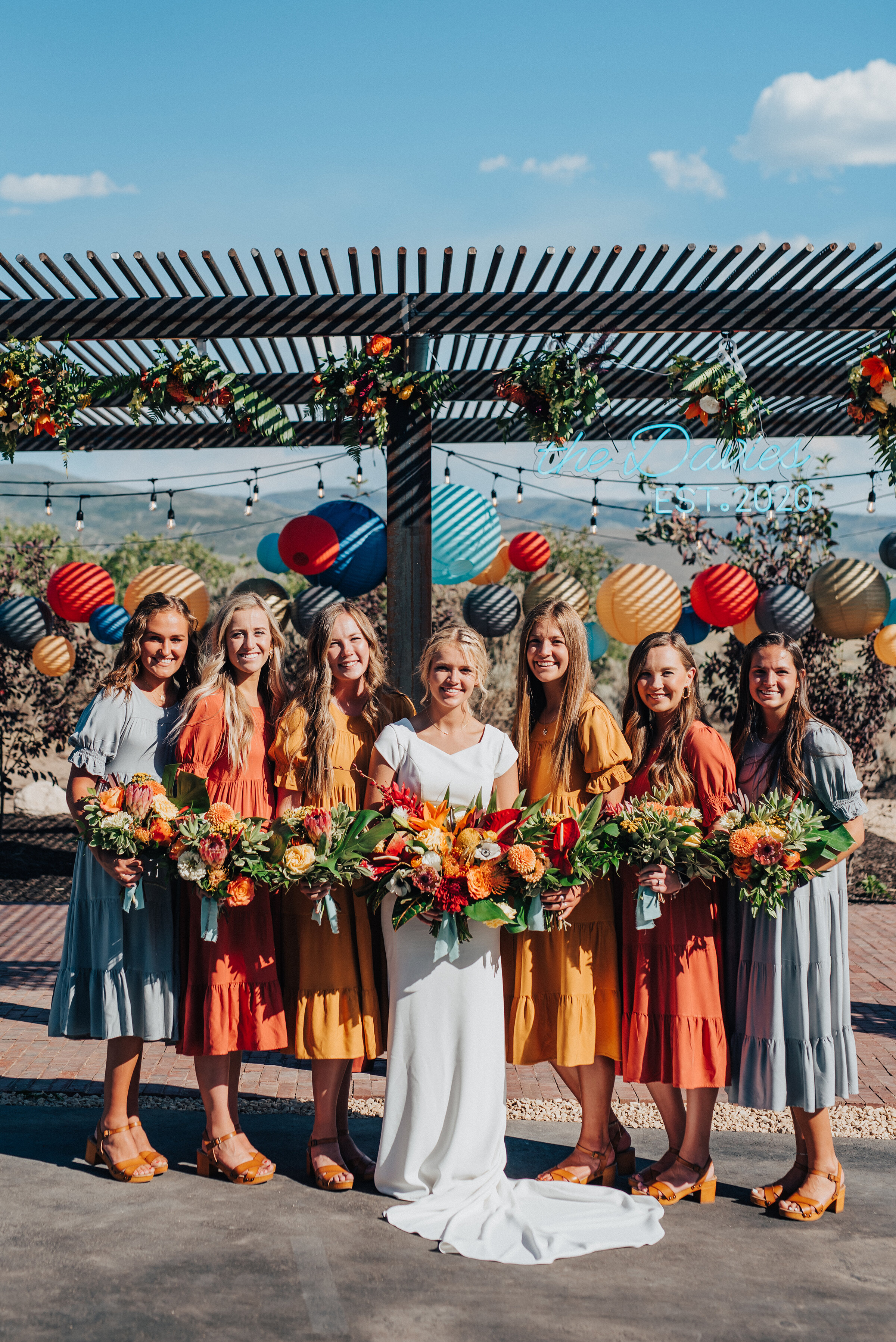 Stunning bridesmaids and bride holding beautifully handcrafted bouquets for this socially distant wedding in Park City. Kristi Alyse Photography Logan Utah photographer Park City wedding photographer Drive-Thru wedding COVID wedding neon signs socia…