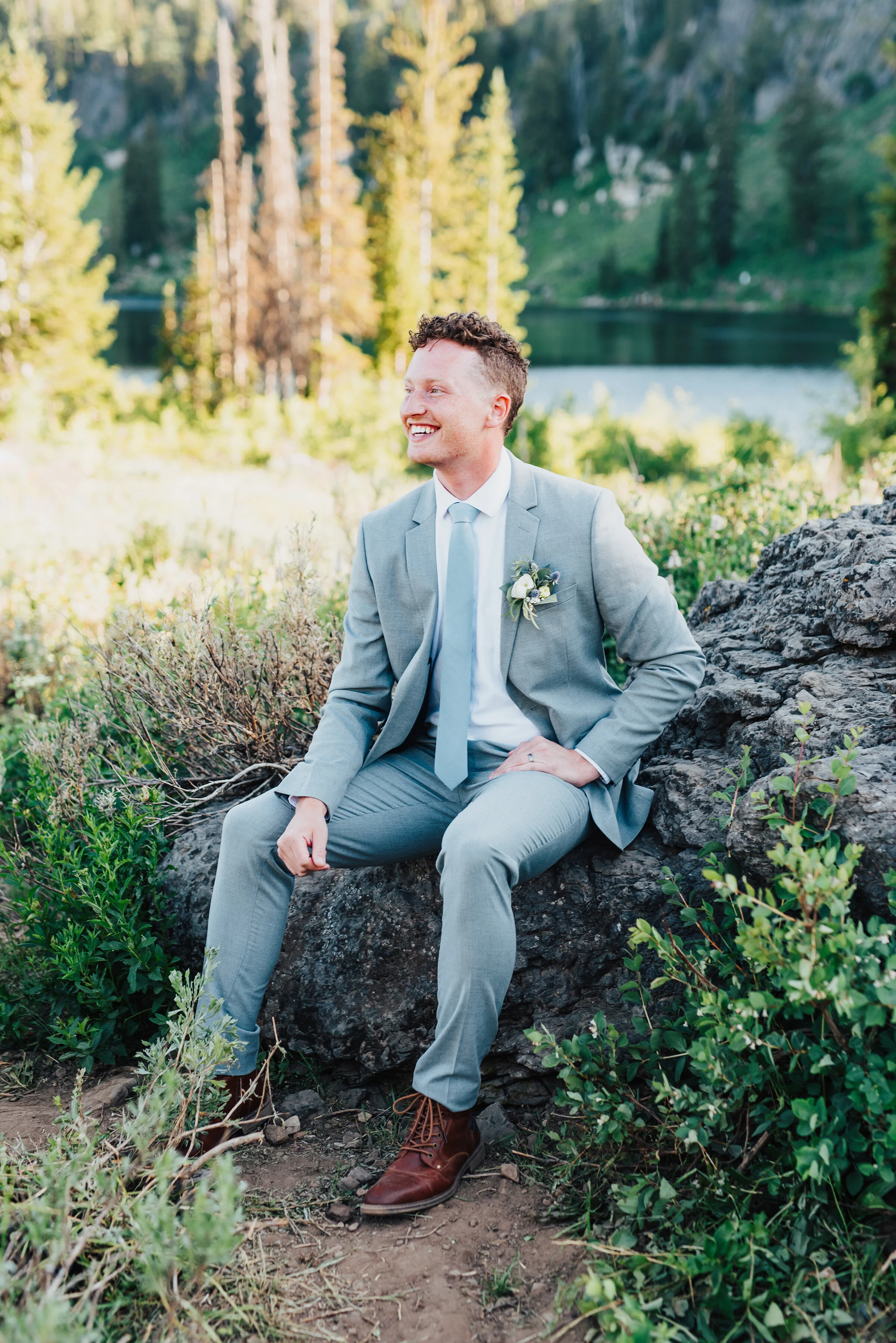  Dapper groom in grey suit wearing a handcrafted boutonnière during this lovely bridal session up Logan canyon. Kristi Alyse photography Logan Utah wedding photographer forest nature dreamy formals Logan canyon Tony Grove scenic bridals Northern Utah