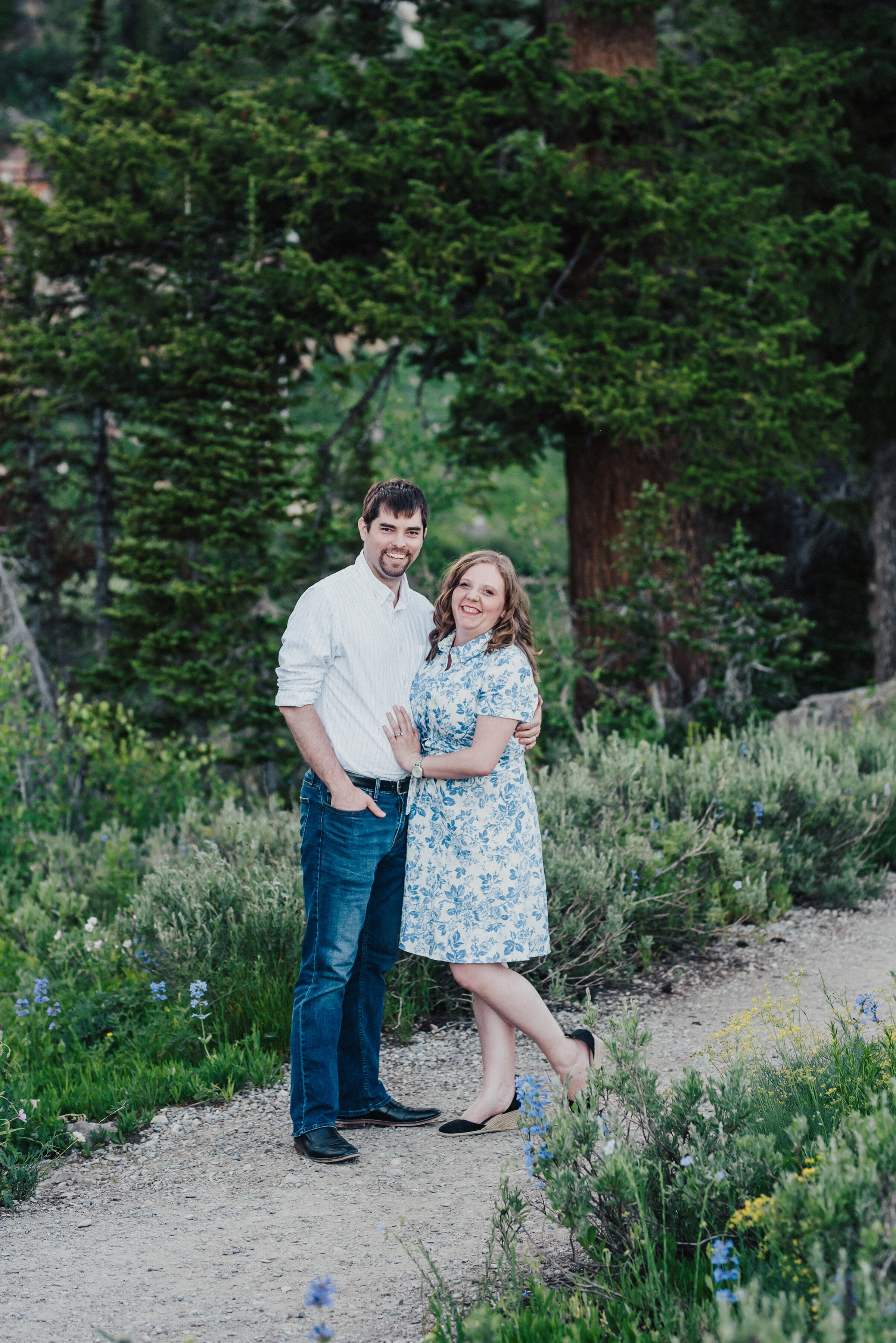  Happy couple during this gorgeous family photo session surrounded by lush forest up Logan canyon. Logan Utah family photographer Kristi Alyse photography Tony Grove forest nature photos Logan canyon light blue family photos wild flowers grand parent