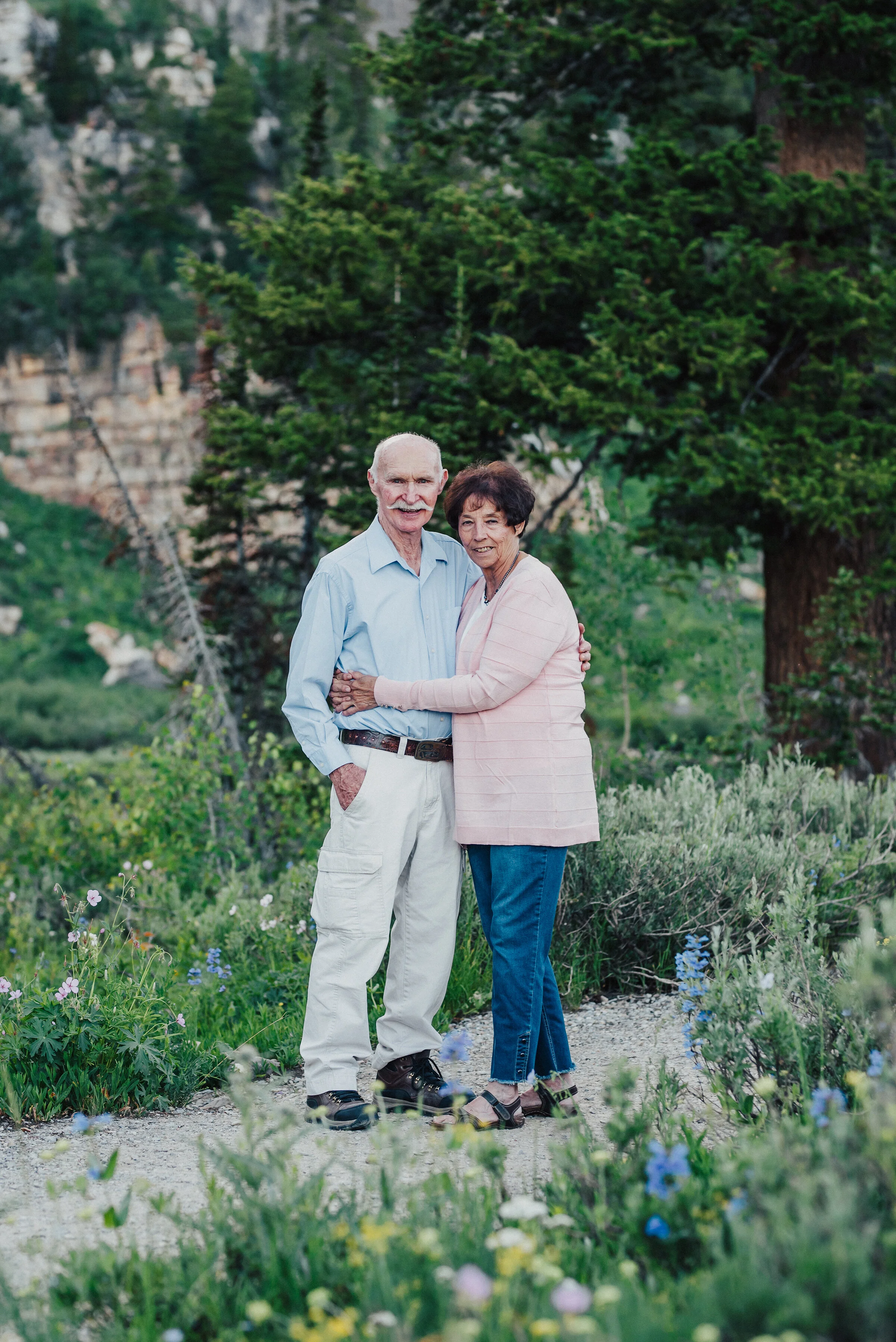  Sweetest grandma and grandpa surrounded by wild flowers up Logan canyon for this lovely family photo session. Logan Utah family photographer Kristi Alyse photography Tony Grove forest nature photos Logan canyon light blue family photos wild flowers 