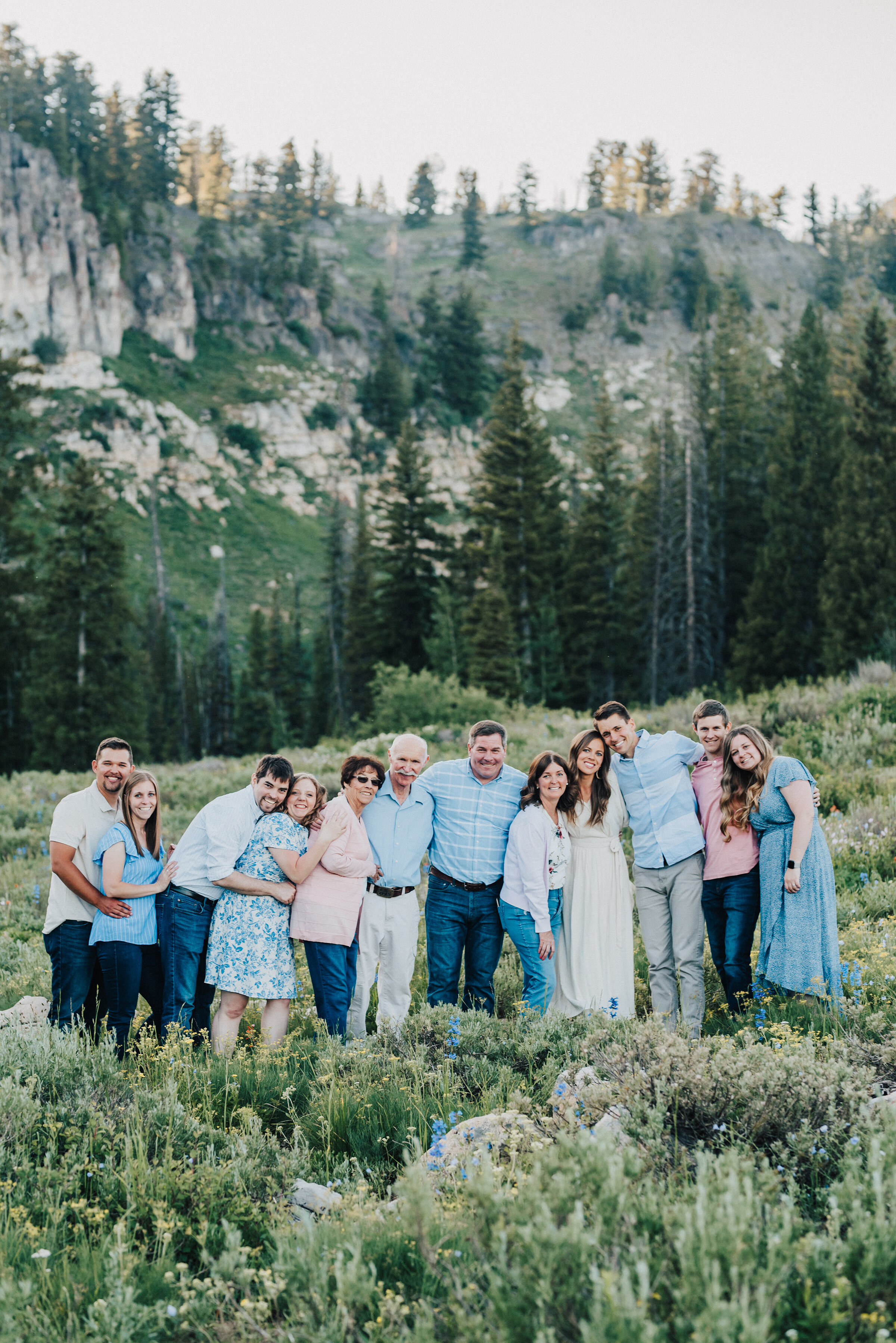  Delightful family photo session surrounded by pine trees and wild flowers up Logan canyon at Tony Grove. Logan Utah family photographer Kristi Alyse photography Tony Grove forest nature photos Logan canyon light blue family photos wild flowers grand parents children parents spouses reunited dreamy scenic photo shoot #kristialysephotography #utahphotographer #familyphotography #logancanyon #familyphotos #forest #wildflowers #northernutah #familyportraits #family 