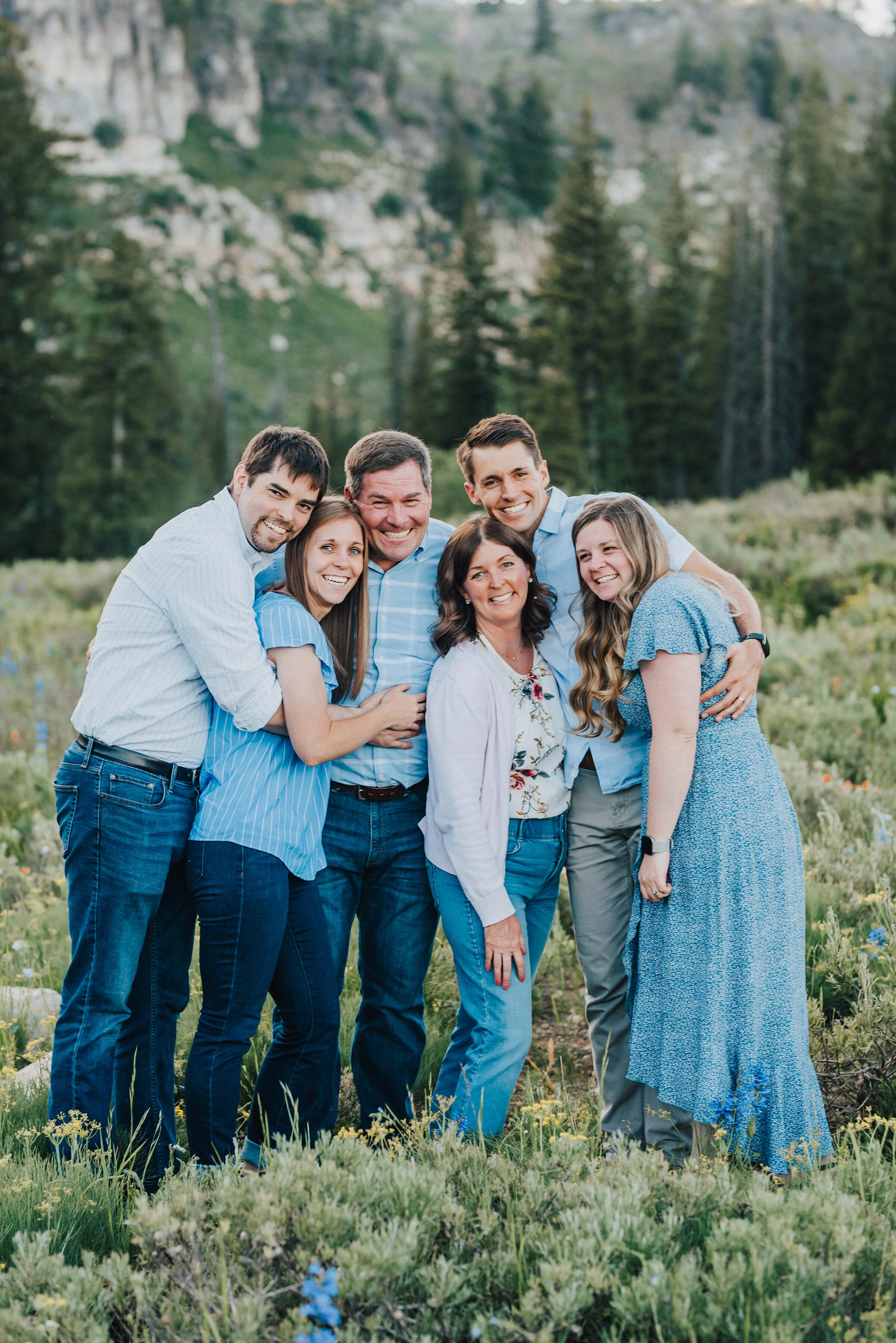  Joyful family photo shoot in nature up Logan canyon at Tony Grove. Logan Utah family photographer Kristi Alyse photography Tony Grove forest nature photos Logan canyon light blue family photos wild flowers grand parents children parents spouses reun