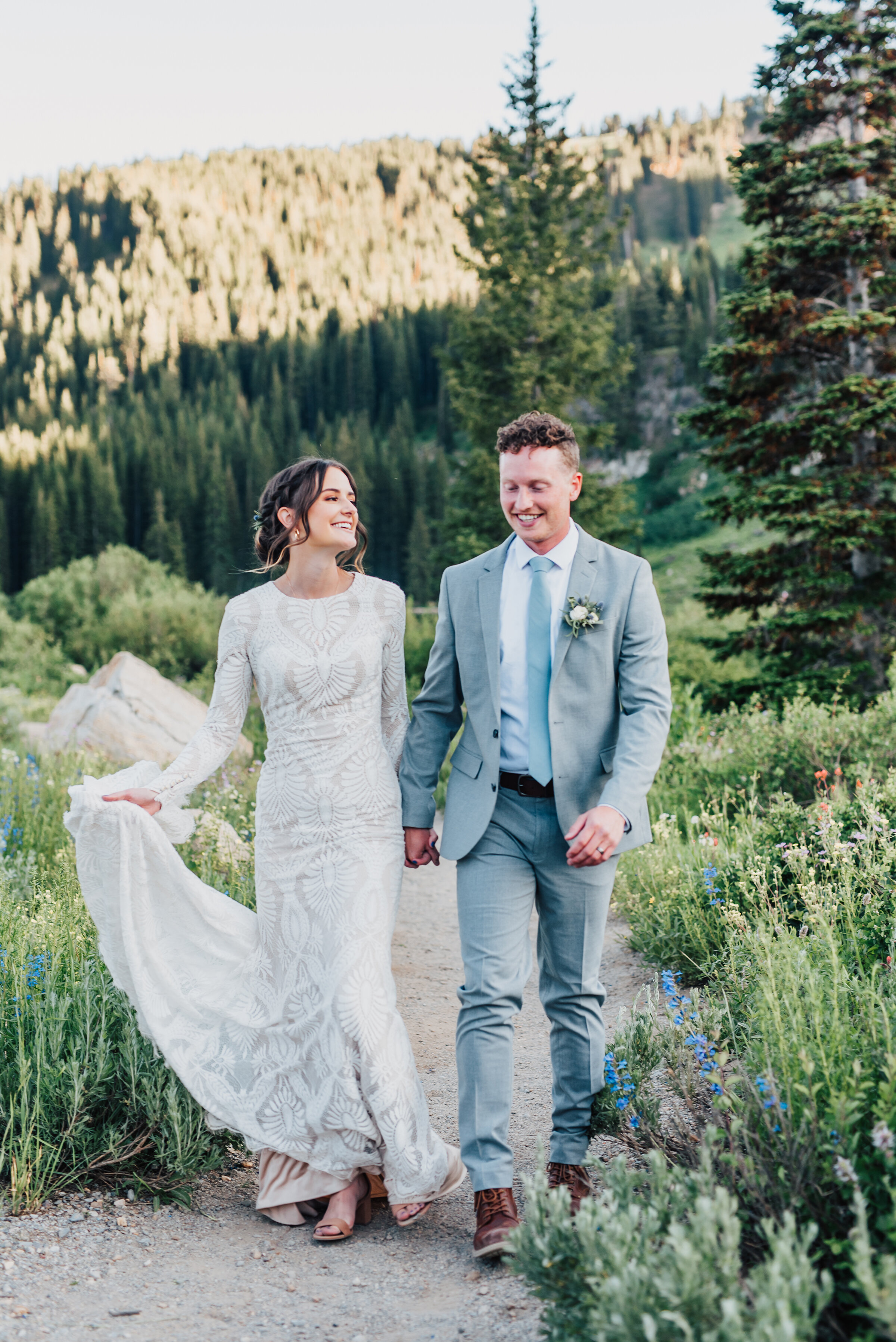  Happy bride and groom walking into forever up Logan canyon at Tony Grove. Kristi Alyse photography Logan Utah wedding photographer forest nature dreamy formals Logan canyon Tony Grove scenic bridals Northern Utah photographer Utah brides bride and g