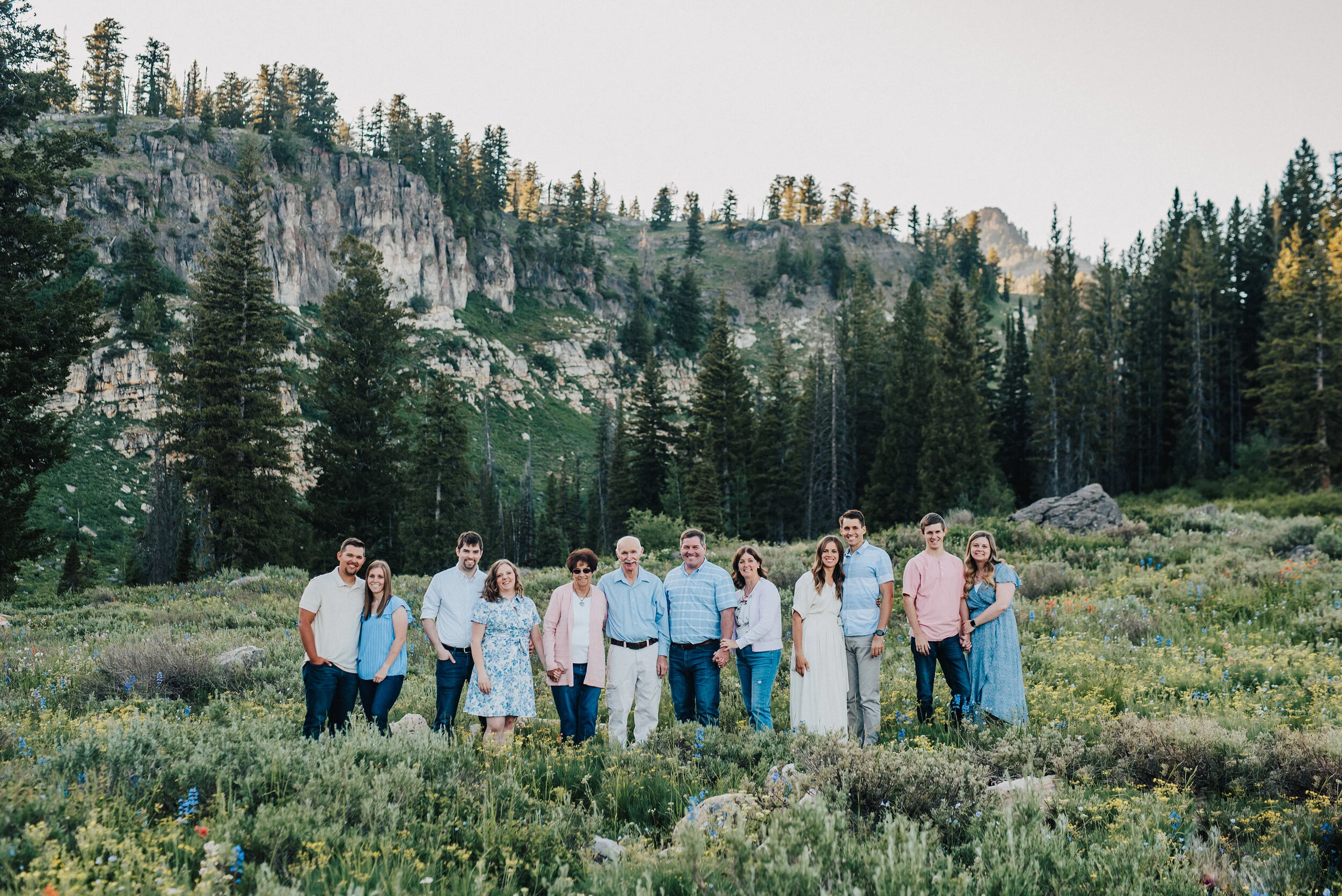 Striking family photo shoot in a gorgeous meadow up Logan canyon at Tony Grove. Logan Utah family photographer Kristi Alyse photography Tony Grove forest nature photos Logan canyon light blue family photos wild flowers grand parents children parents…