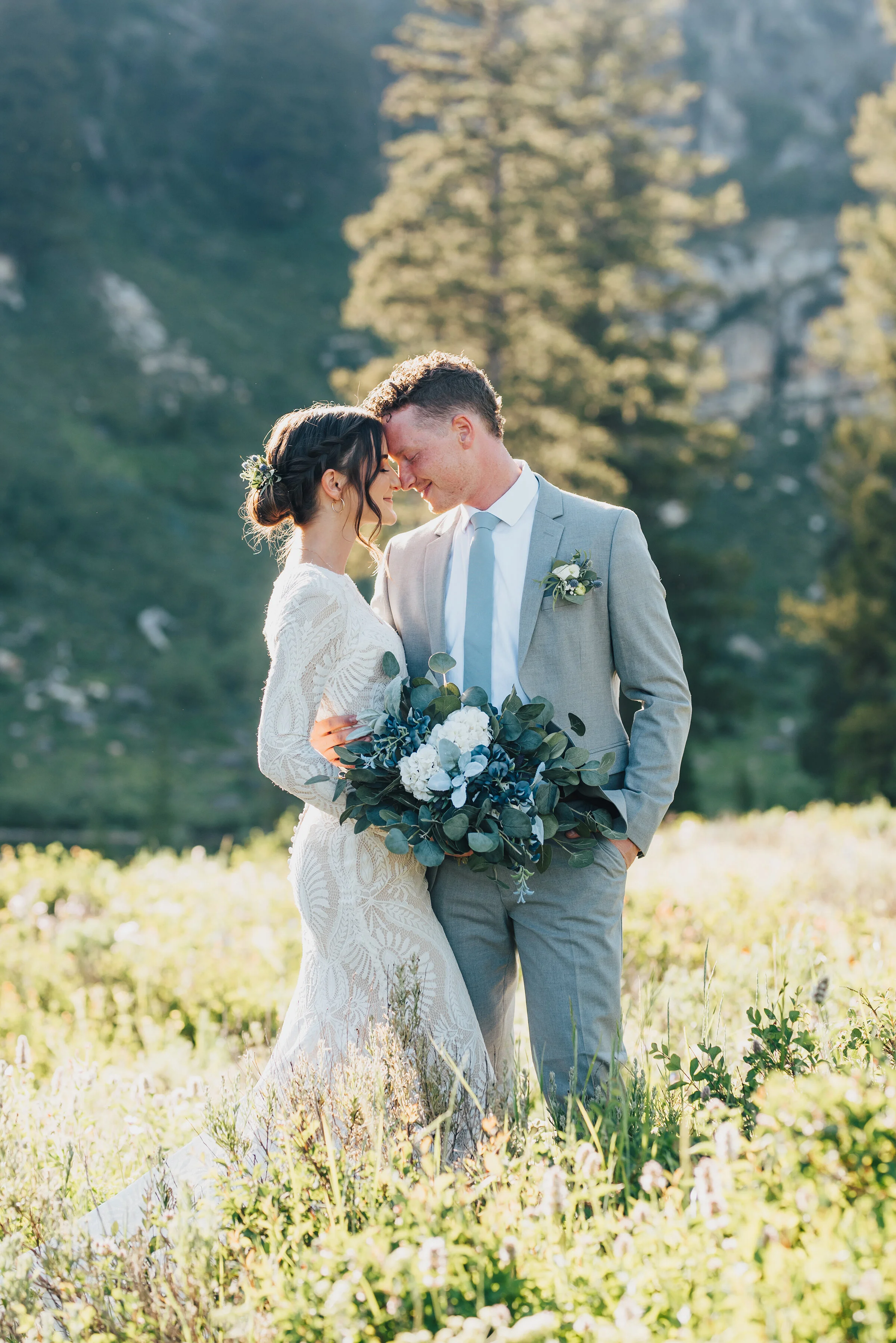  Tender embrace amongst wild flowers and pine trees up Logan canyon at Tony Grove. Kristi Alyse photography Logan Utah wedding photographer forest nature dreamy formals Logan canyon Tony Grove scenic bridals Northern Utah photographer Utah brides bri