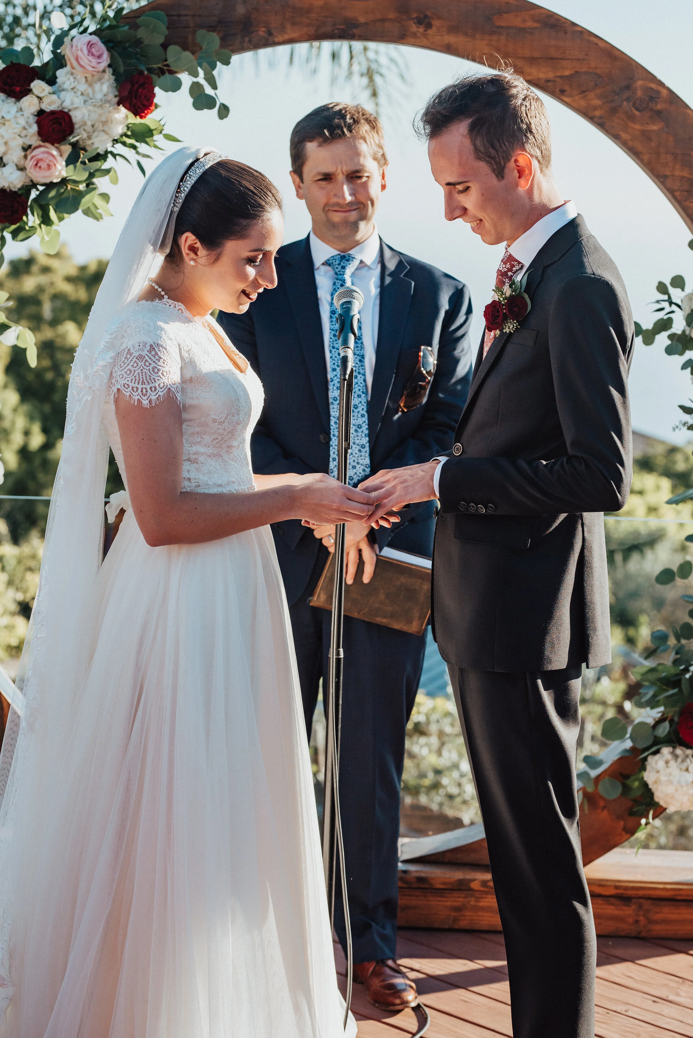  Gorgeous bride placing her grooms wedding ring on his hand at this charming backyard wedding in Laguna Beach. Kristi Alyse photography Laguna Beach wedding California brides Logan Utah wedding photographer backyard wedding destination photographer c