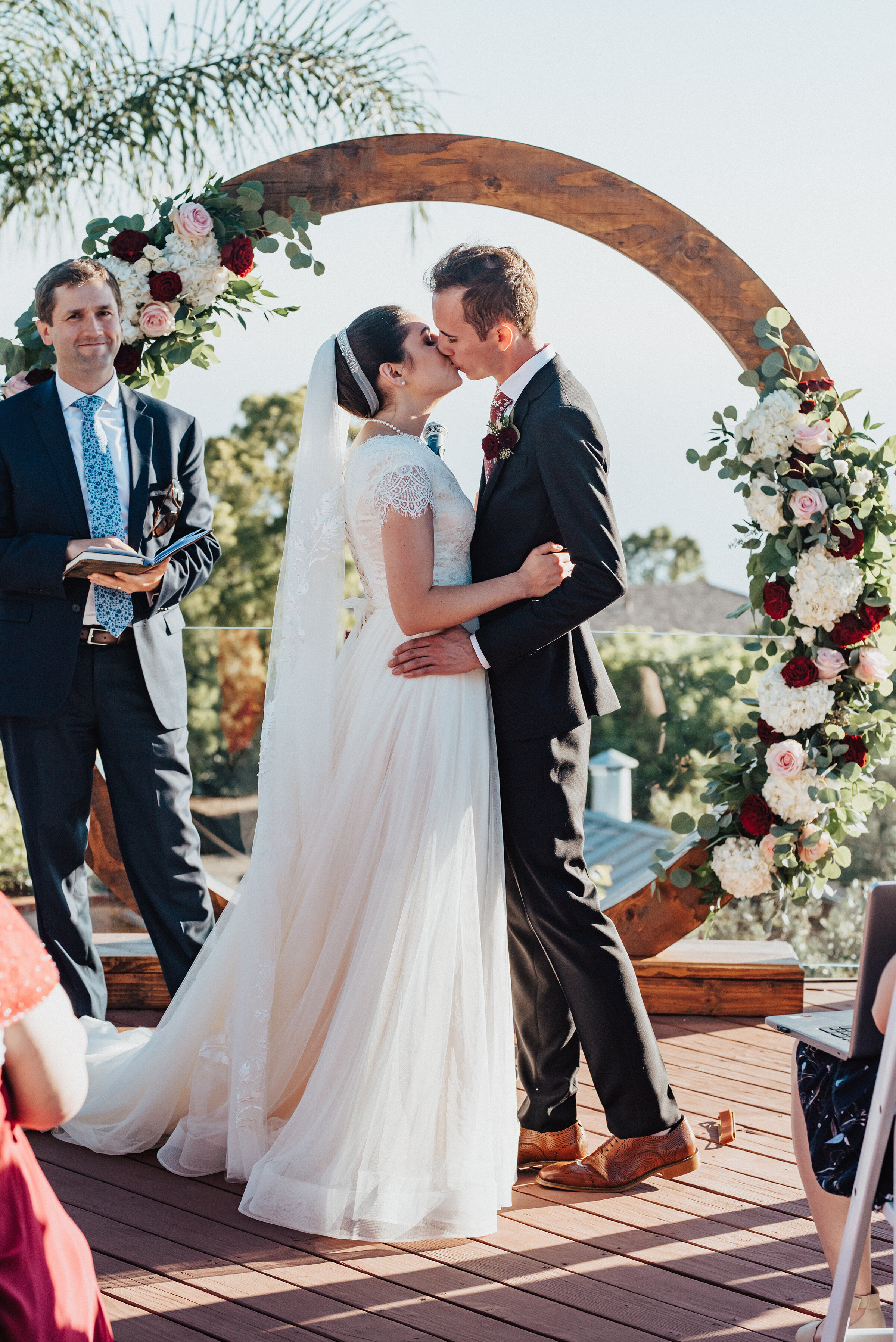  Bride and Groom embracing, moments after saying “I Do”, at this lovely backyard wedding in Laguna Beach. Kristi Alyse photography Laguna Beach wedding California brides Logan Utah wedding photographer backyard wedding destination photographer covid 